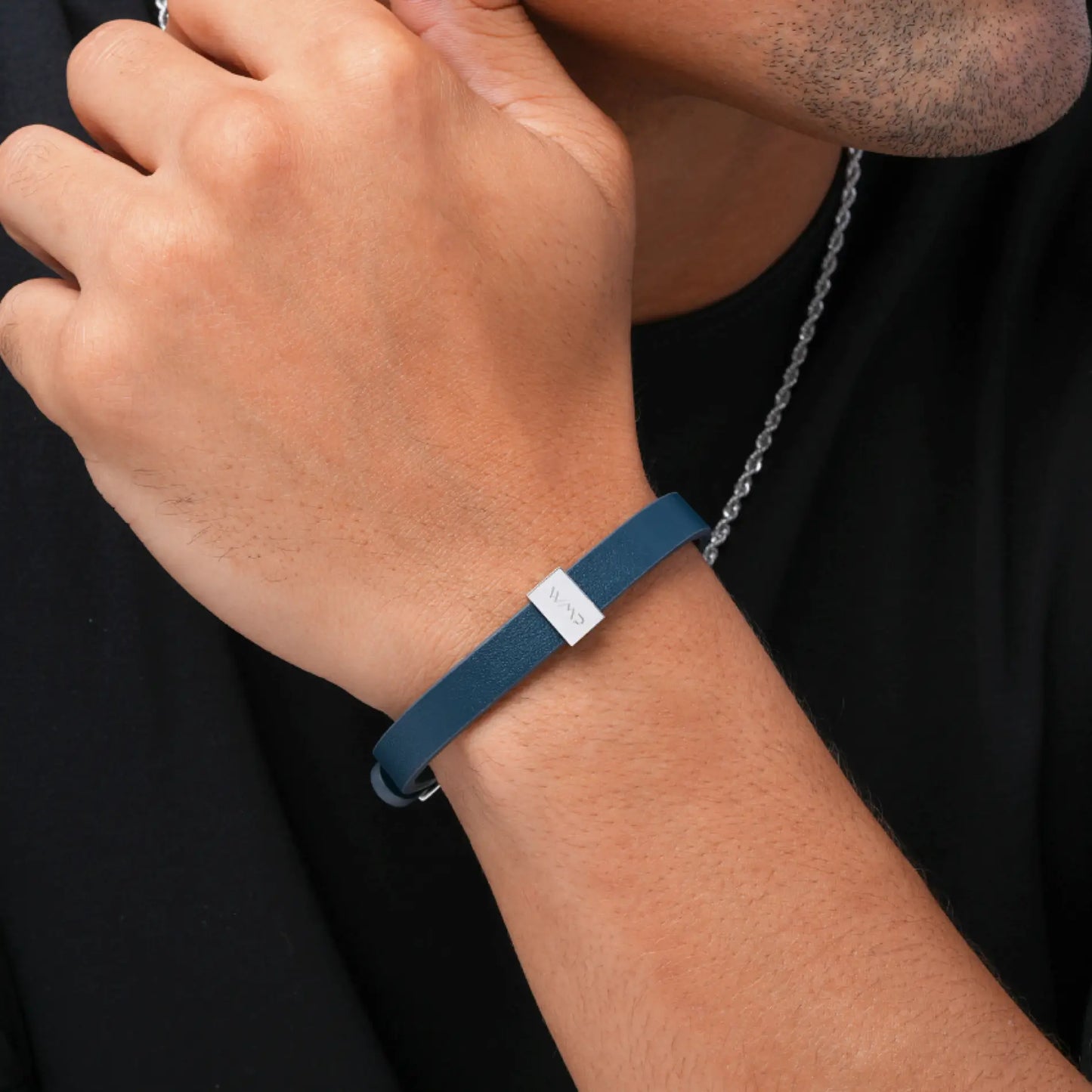 Silver / Navy Leather || Close up of model wearing Blue Leather Cuff Bracelet with Silver Metal Accents.