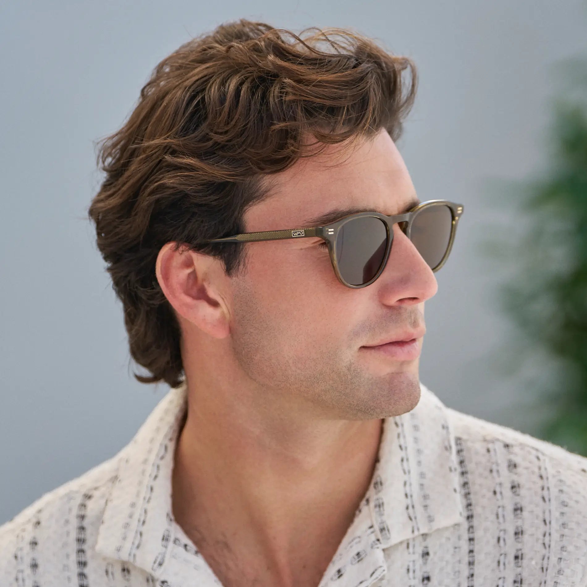 Khaki Green / Dark Brown Lens || Model wearing Men's Round Polarized Sunglasses with Green Frame and Dark Brown Lenses