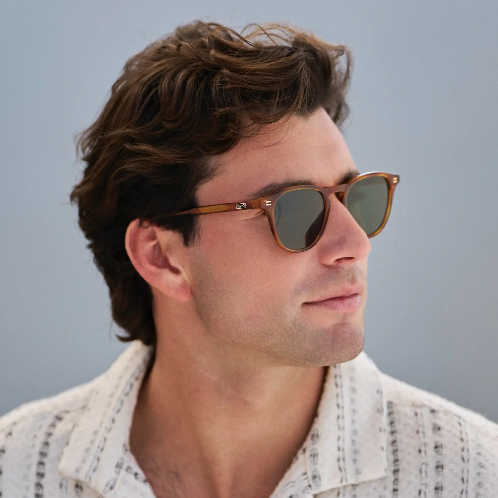 Honey Tortoise / Smoke Green Lens || Model wearing Men's Round Polarized Sunglasses with Honey Tortoise Frame and Green Lenses