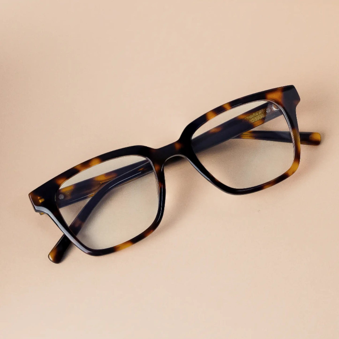 Tortoise Brown || Bold rectangular prescription glasses with thick tortoise brown frame and keyhole bridge on neutral background