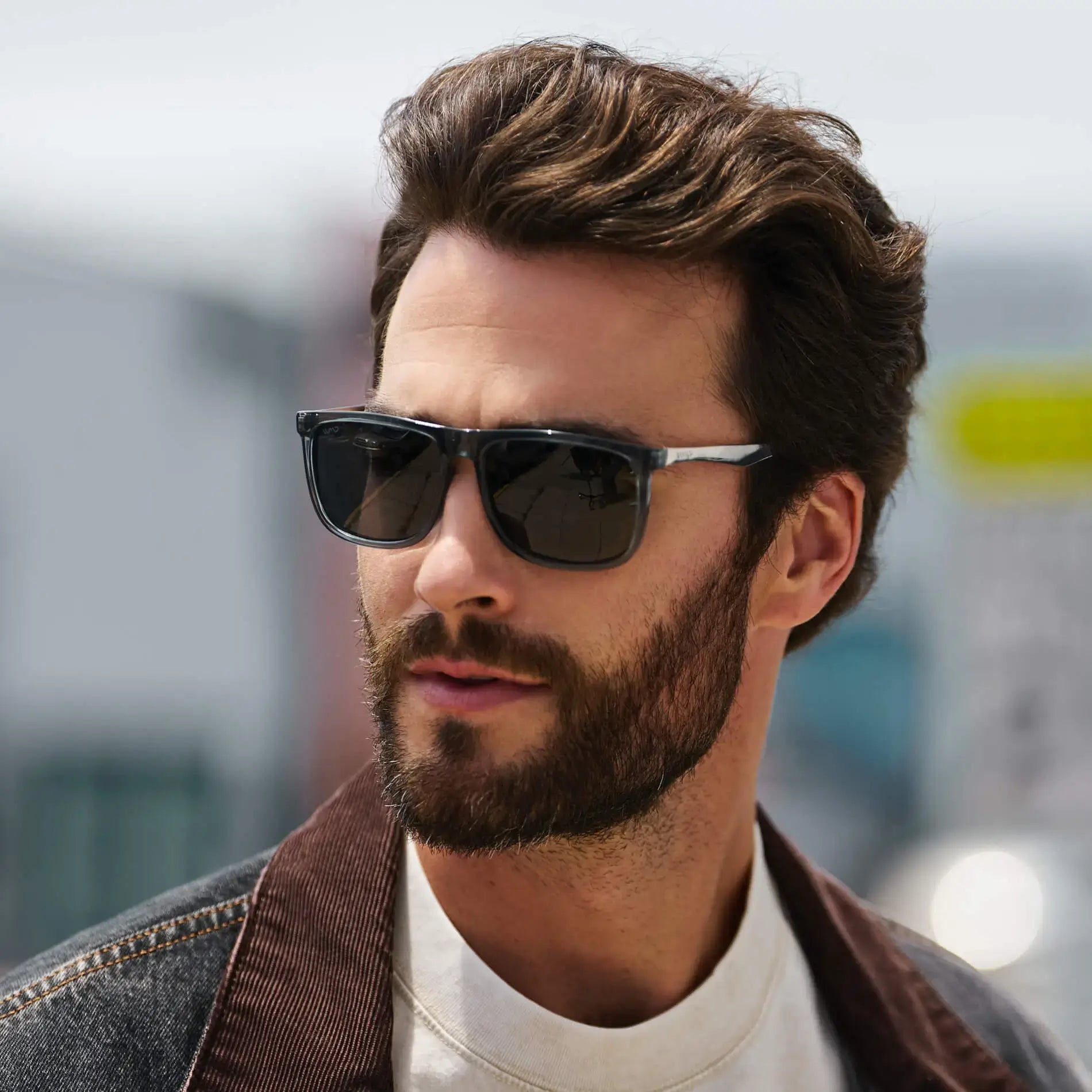 Stone Blue / Grey || Square prescription sunglasses with grey lenses and stone blue acetate frame with metal accents worn by man outdoors