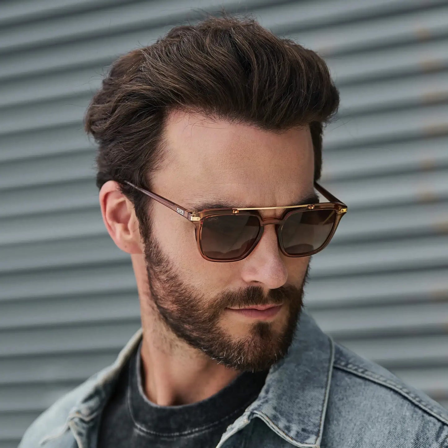 Crystal Brown / Amber Lens || Square modern prescription sunglasses with crystal brown acetate frame, double bridge, and amber lenses worn outdoors by a man