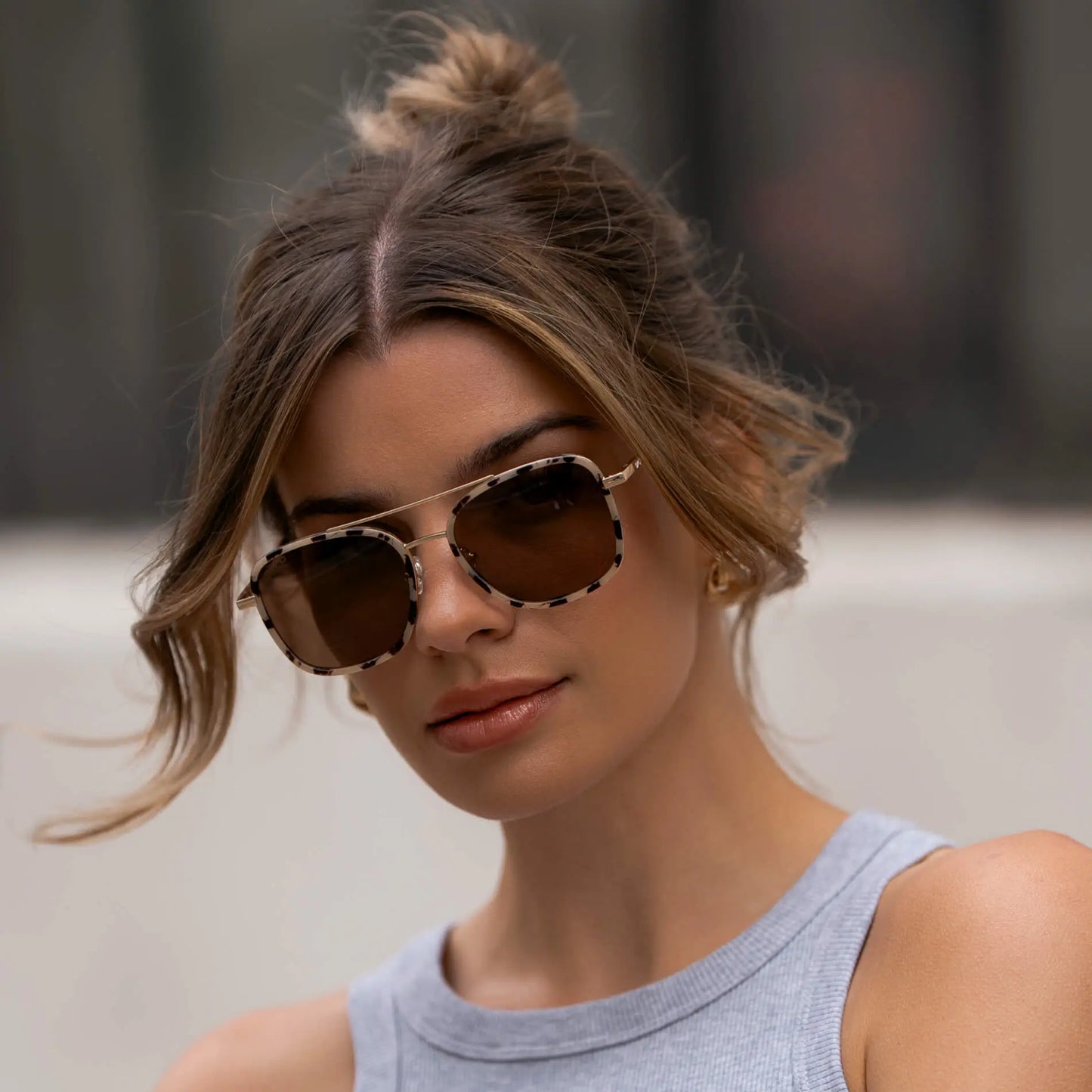 Beige Tortoise / Amber || Women wearing Oversized Square Aviator Prescription Eyeglasses with a Beige Tortoise Acetate and Stainless Steel Frame and Brown Lenses