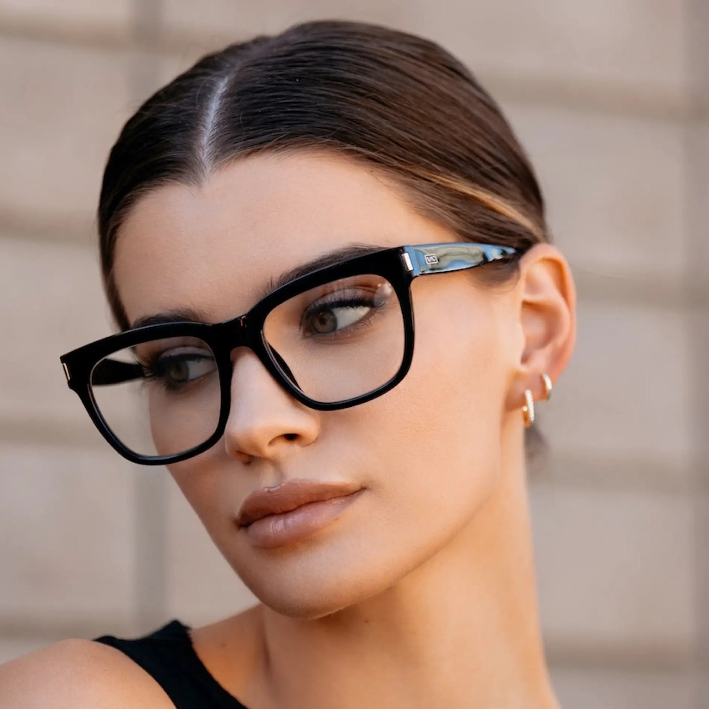 Black || Thick oversized square prescription eyeglasses with black frame worn by woman outdoors in natural light