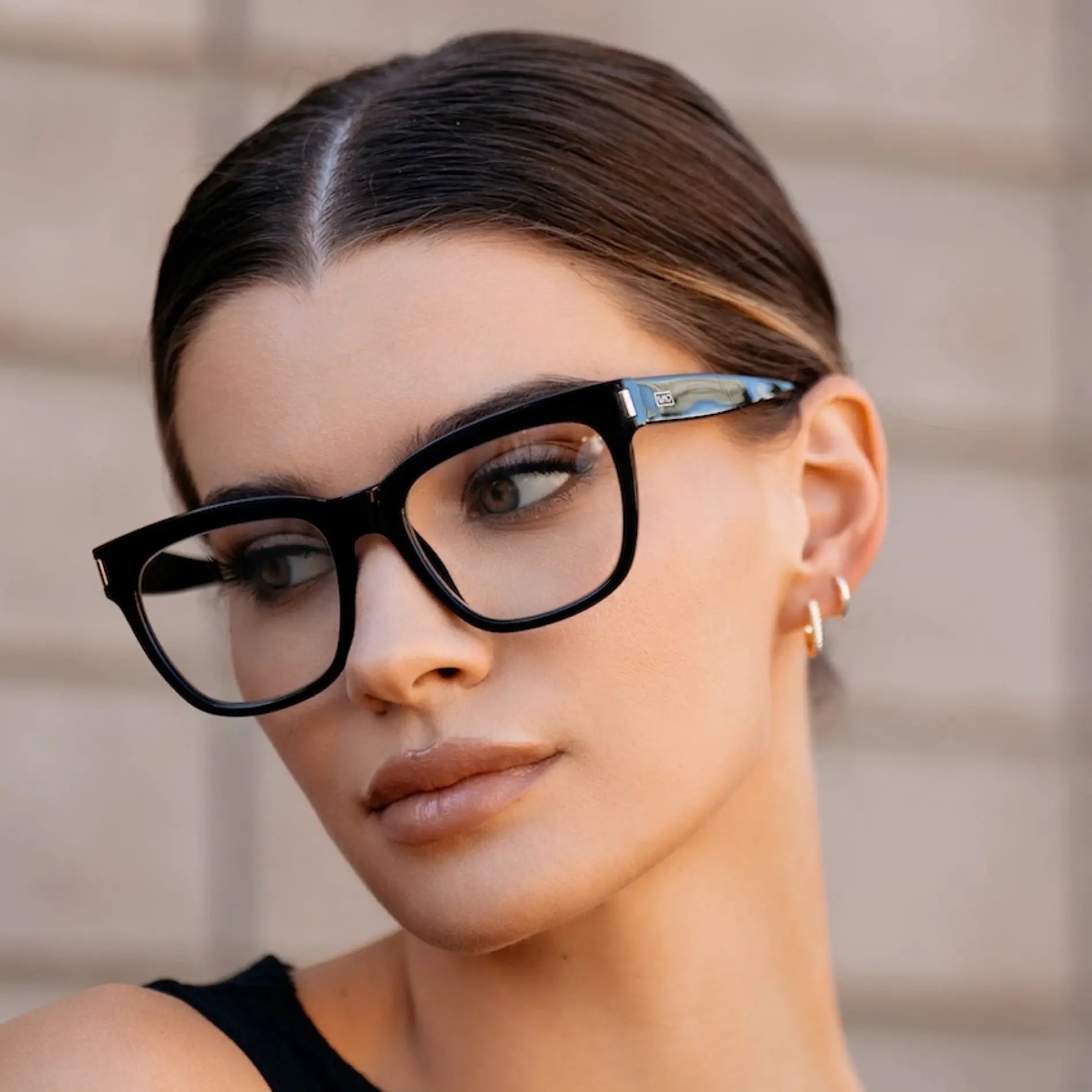 Black || Thick oversized square prescription eyeglasses with black frame worn by woman outdoors in natural light