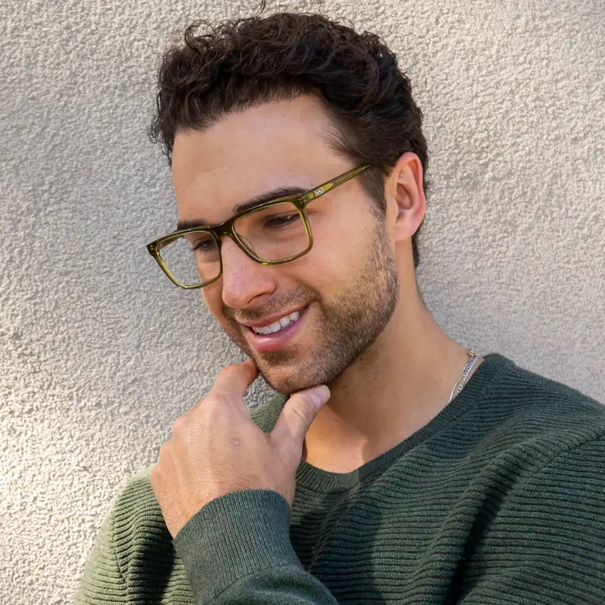 Crystal Sage Green || Rectangular modern prescription glasses with green frame and clear lens worn by man outdoors