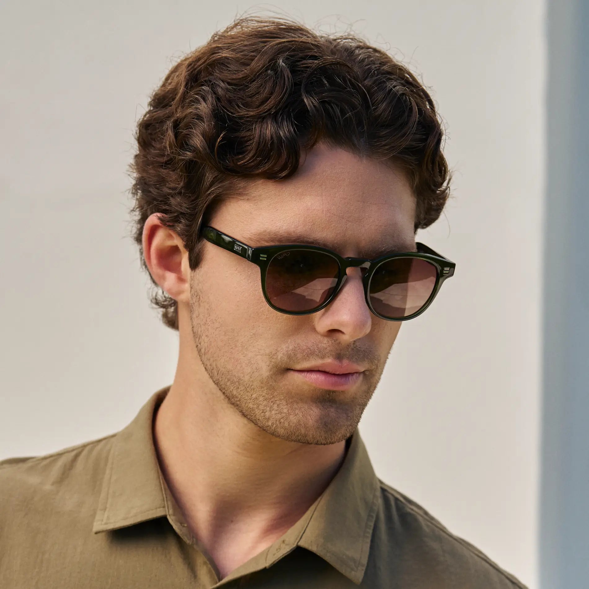Jade Green / Brown Gold Gradient Lens || Model wearing Men's Round Polarized Sunglasses with Jade Green Acetate Frame and Brown Gold Gradient Lens