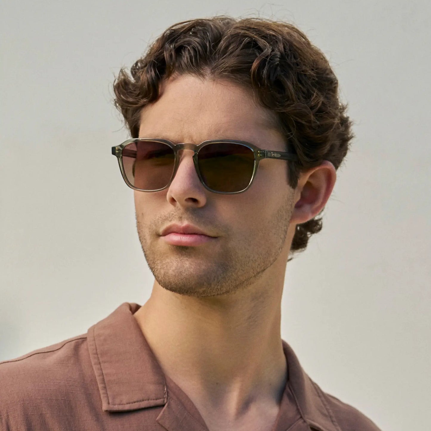 Sage Green / Brown Gradient Lens || Model wearing Men's Sage Green Geometric Square Frame Sunglasses with Brown Gradient Polarized Lenses