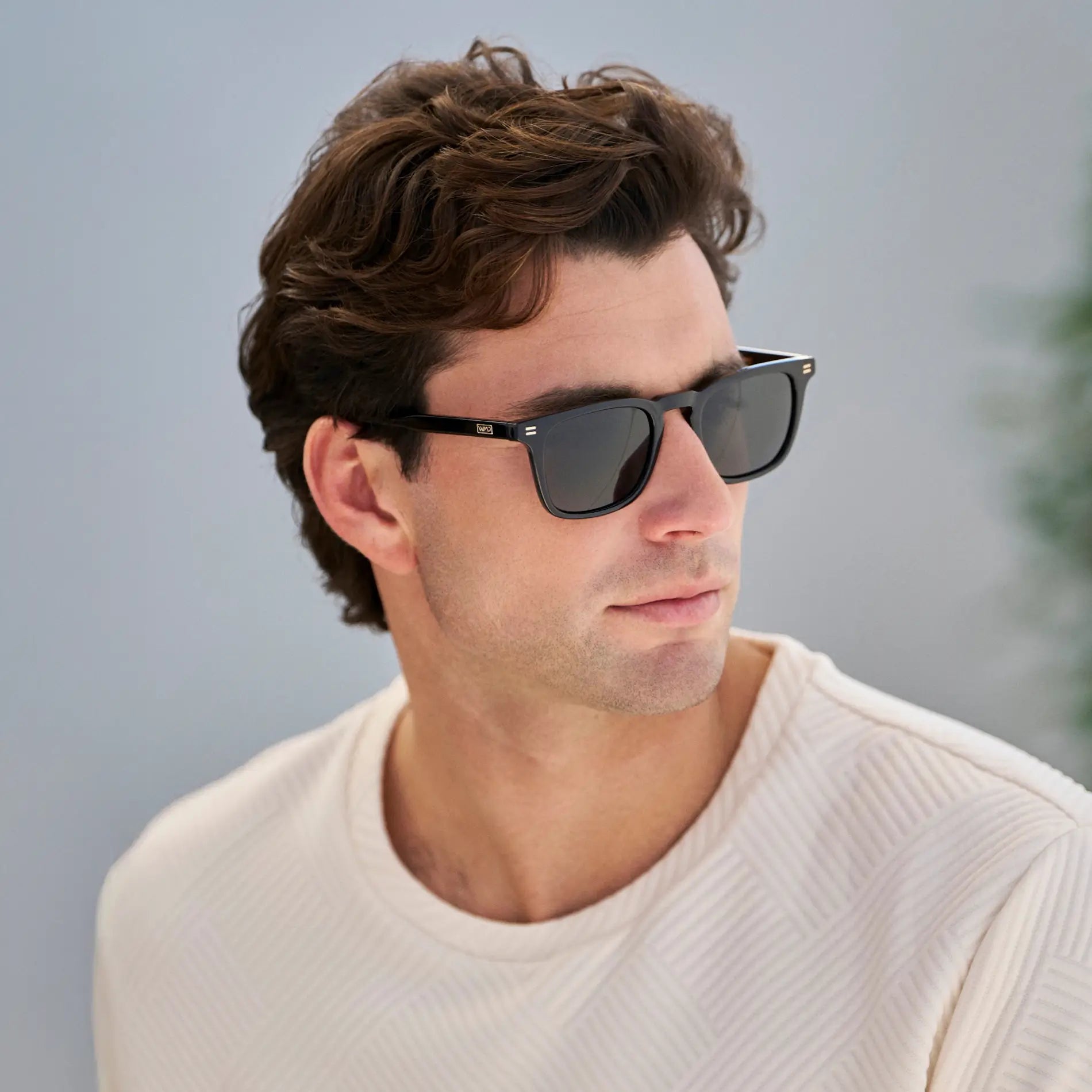 Black / Triple Black Lens || Model wearing Men's Rectangular Polarized Sunglasses with Black Frame and Black Lenses