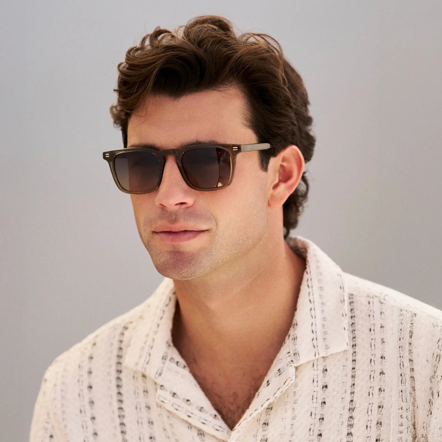 Khaki Green / Amber || Men's Rectangular Prescription Sunglasses with Khaki Green Frame and Amber Lenses worn by a man in natural light