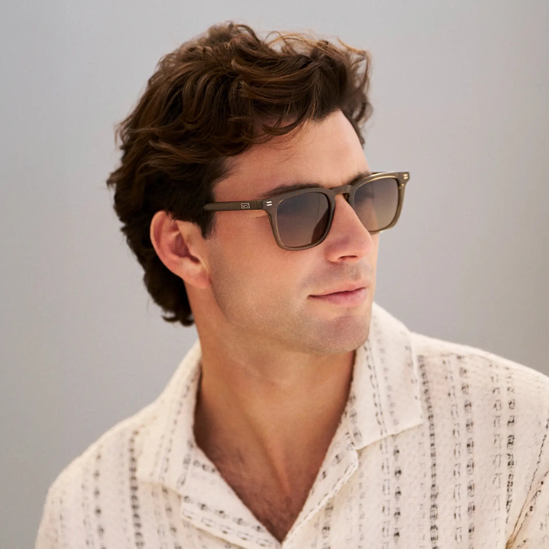 Khaki Green / Grey Brown Gradient Lens || Model wearing Men's Rectangular Polarized Sunglasses with Green Frame and Grey Brown Gradient Lenses