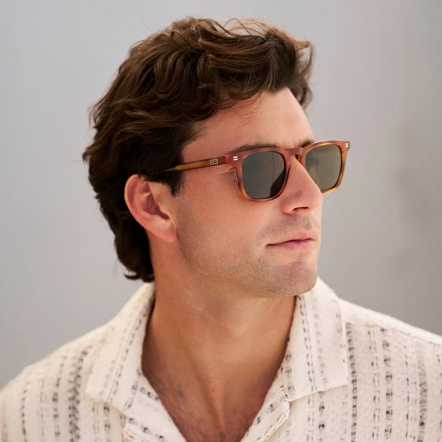 Honey Tortoise / Smoke Green Lens || Model wearing Men's Rectangular Polarized Sunglasses with Honey Tortoise Frame and Green Lenses