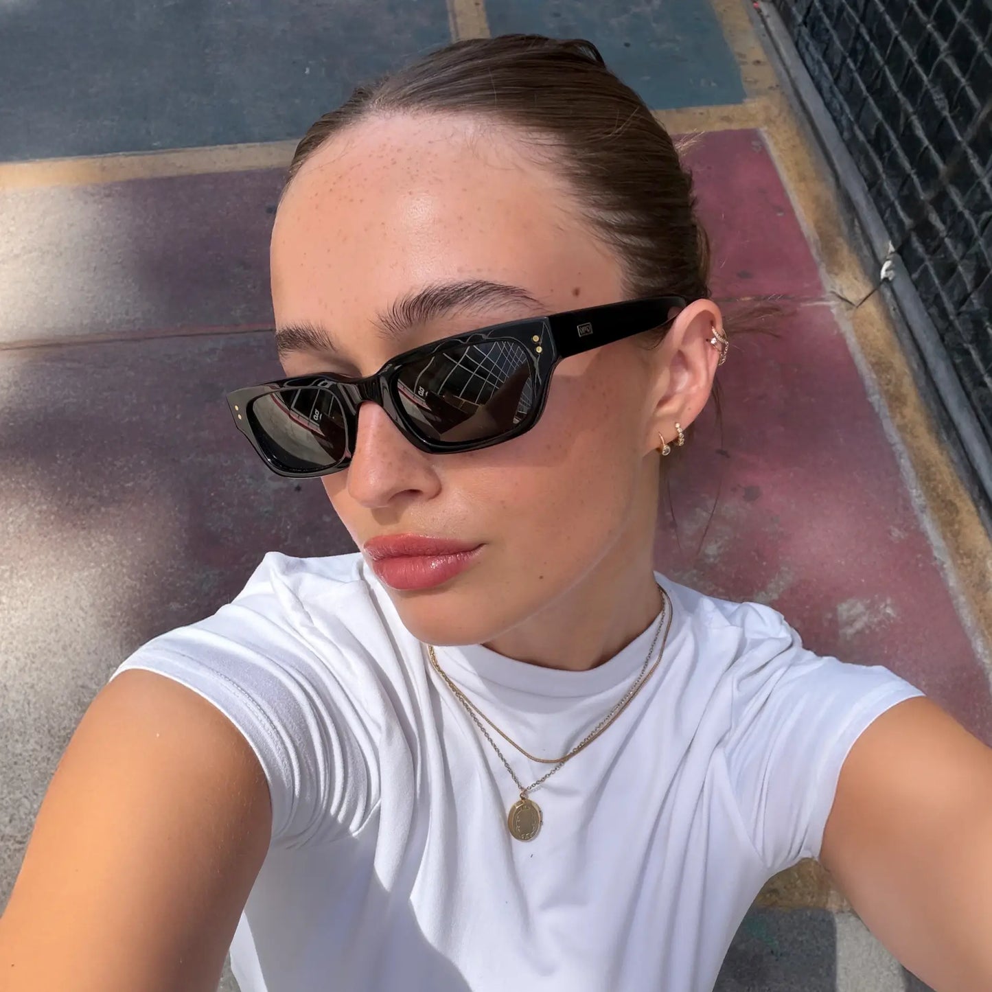 Black / Triple Black Lens || Model wearing Women's Rectangular Polarized Sunglasses with Black Frame and Black Lenses
