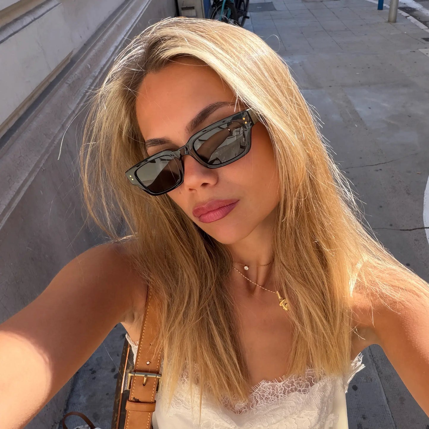 Black / Triple Black Lens || Model wearing Women's Rectangular Polarized Sunglasses with Black Frame and Black Lenses