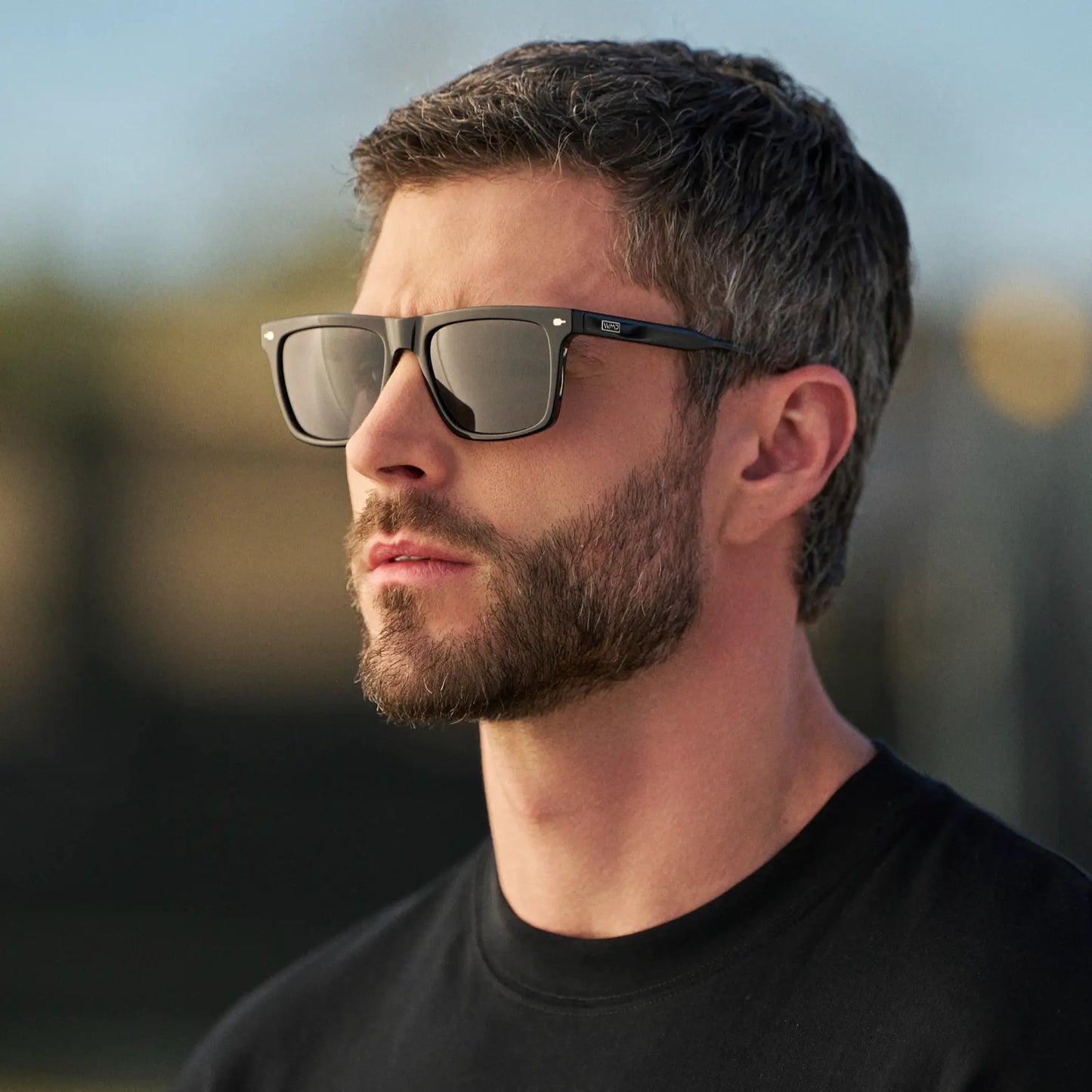 Black / Black Lens || Man wearing Classic Rectangular Sunglasses with Black Frame and Black Lens outdoors