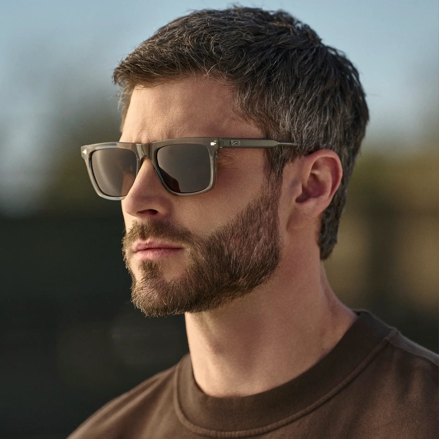 Sage Green / Dark Brown Lens || Man wearing Classic Rectangular Sunglasses with Sage Green Frame and Dark Brown Lens outdoors