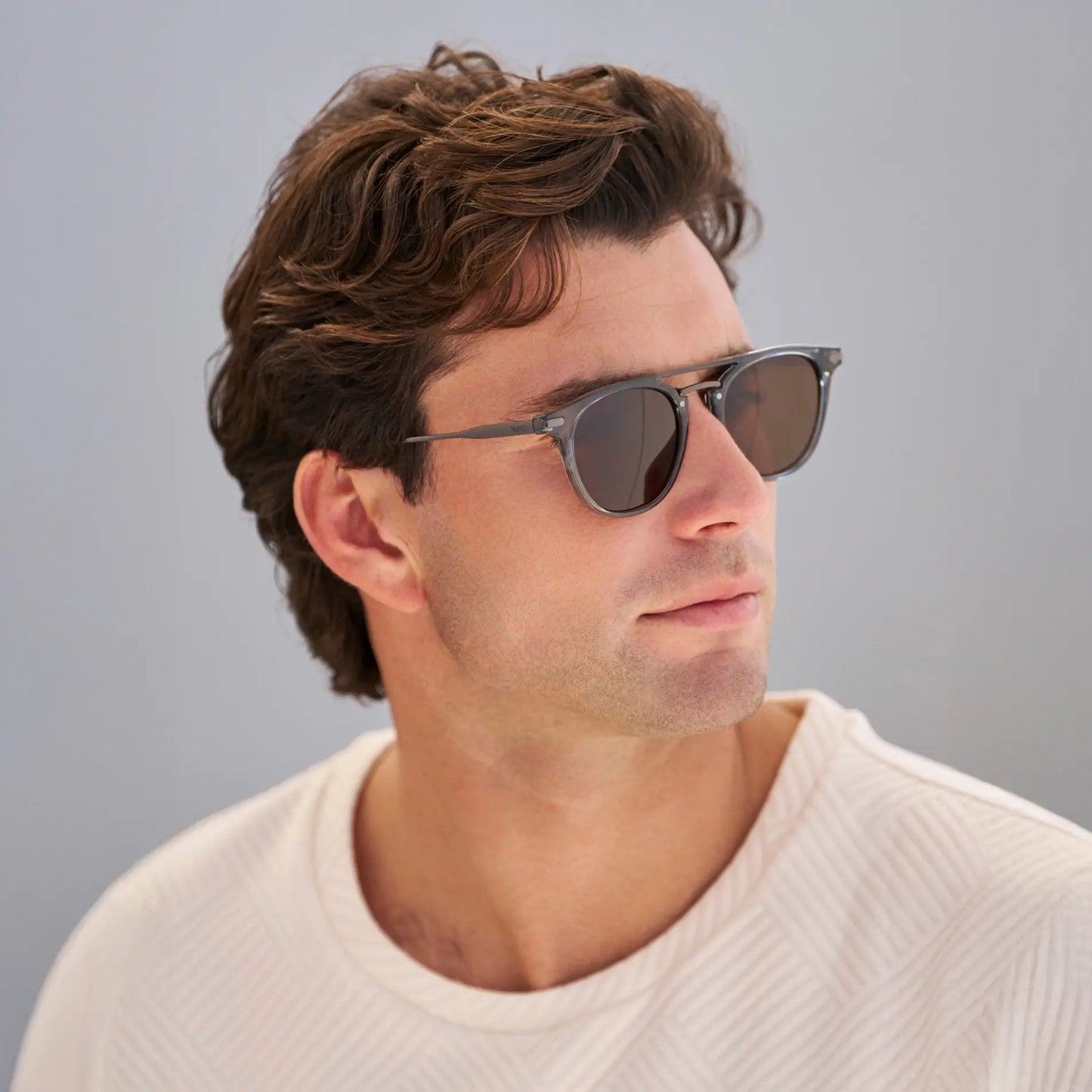 Stone Blue / Dark Brown Lens || Model wearing Men's Round Polarized Sunglasses with Stone Blue Metal Frame and Dark Brown Lenses