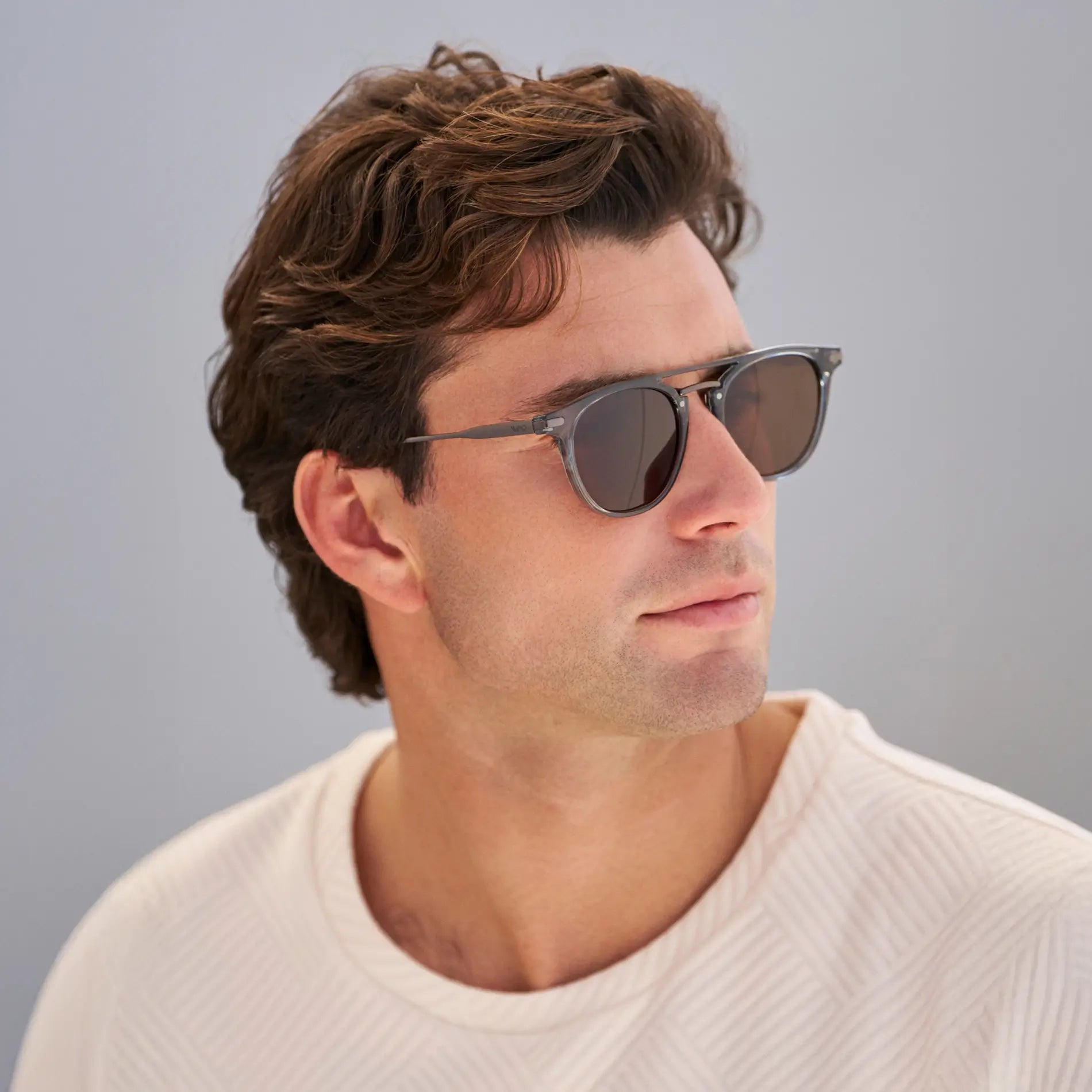Stone Blue / Dark Brown Lens || Model wearing Men's Round Polarized Sunglasses with Stone Blue Metal Frame and Dark Brown Lenses