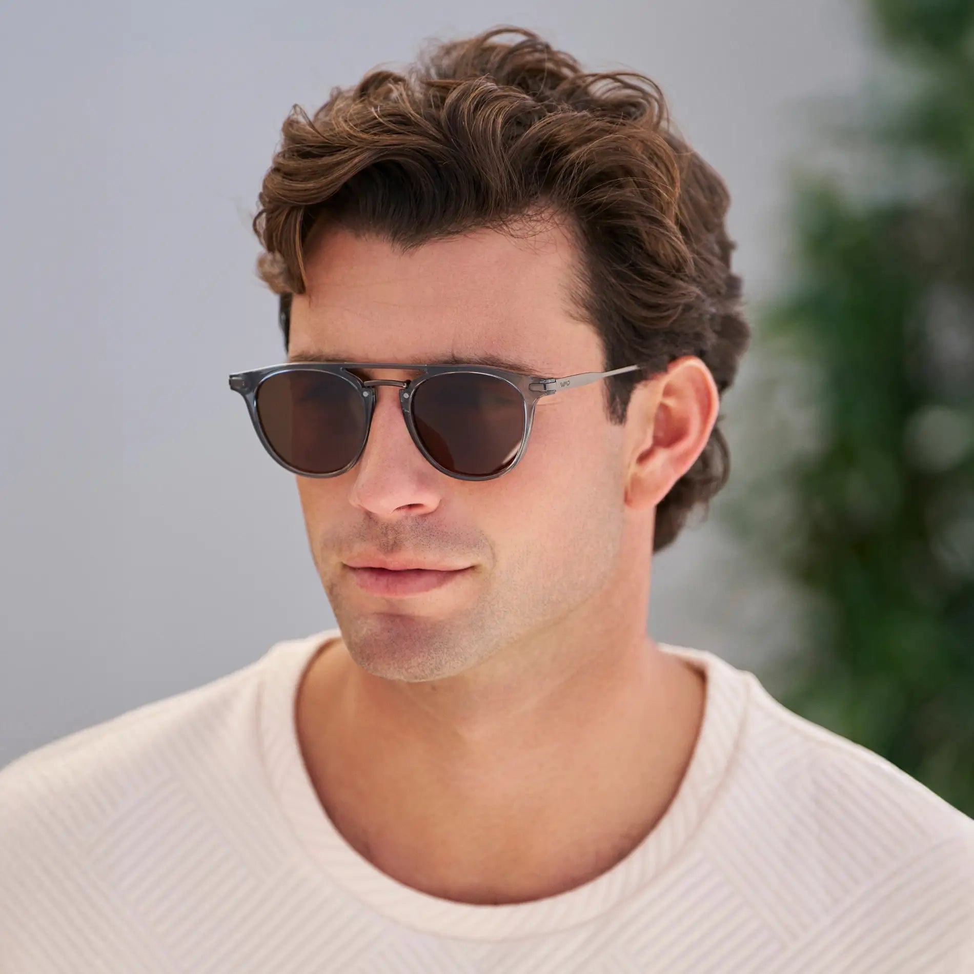 Stone Blue / Dark Brown Lens || Model wearing Men's Round Polarized Sunglasses with Stone Blue Metal Frame and Dark Brown Lenses