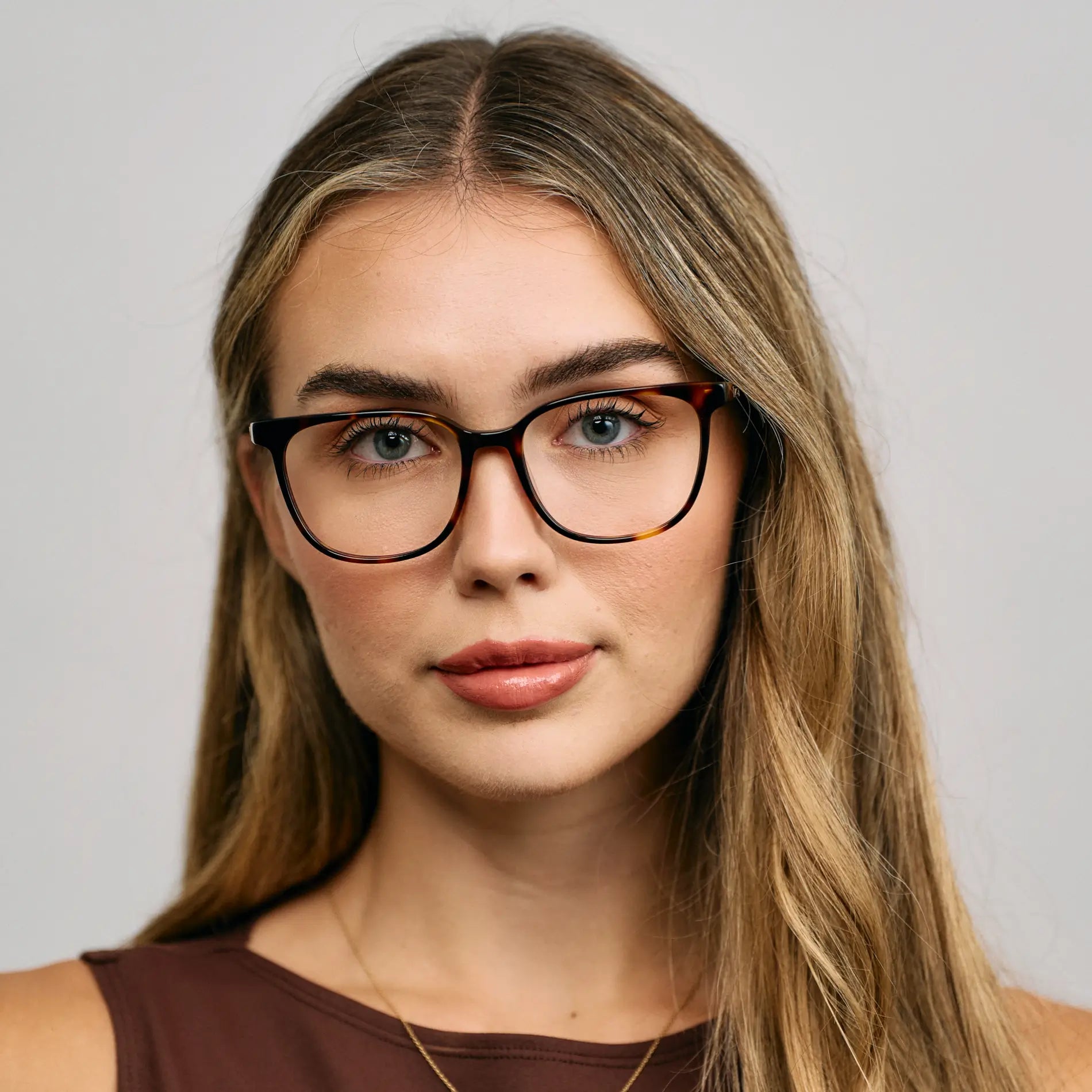 Brown Tortoise || Female Model wearing Women's Rectangular Blue Light Blocking Glasses with a Brown Tortoise Acetate Frame and Clear Lens