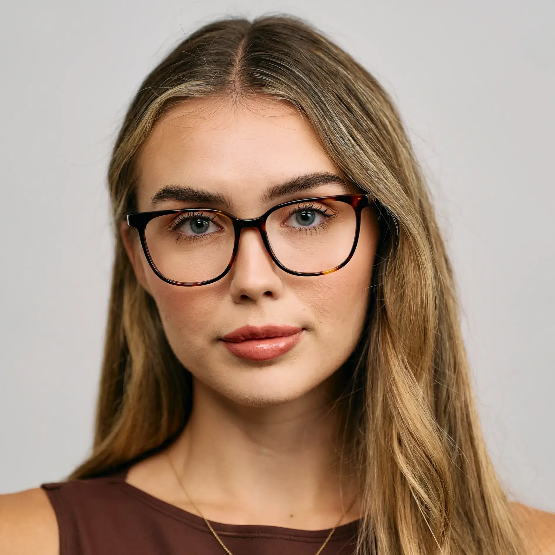 Brown Tortoise || Model wearing Women's Rectangular Prescription Glasses with a Brown Tortoise Acetate Frame and Clear Lens