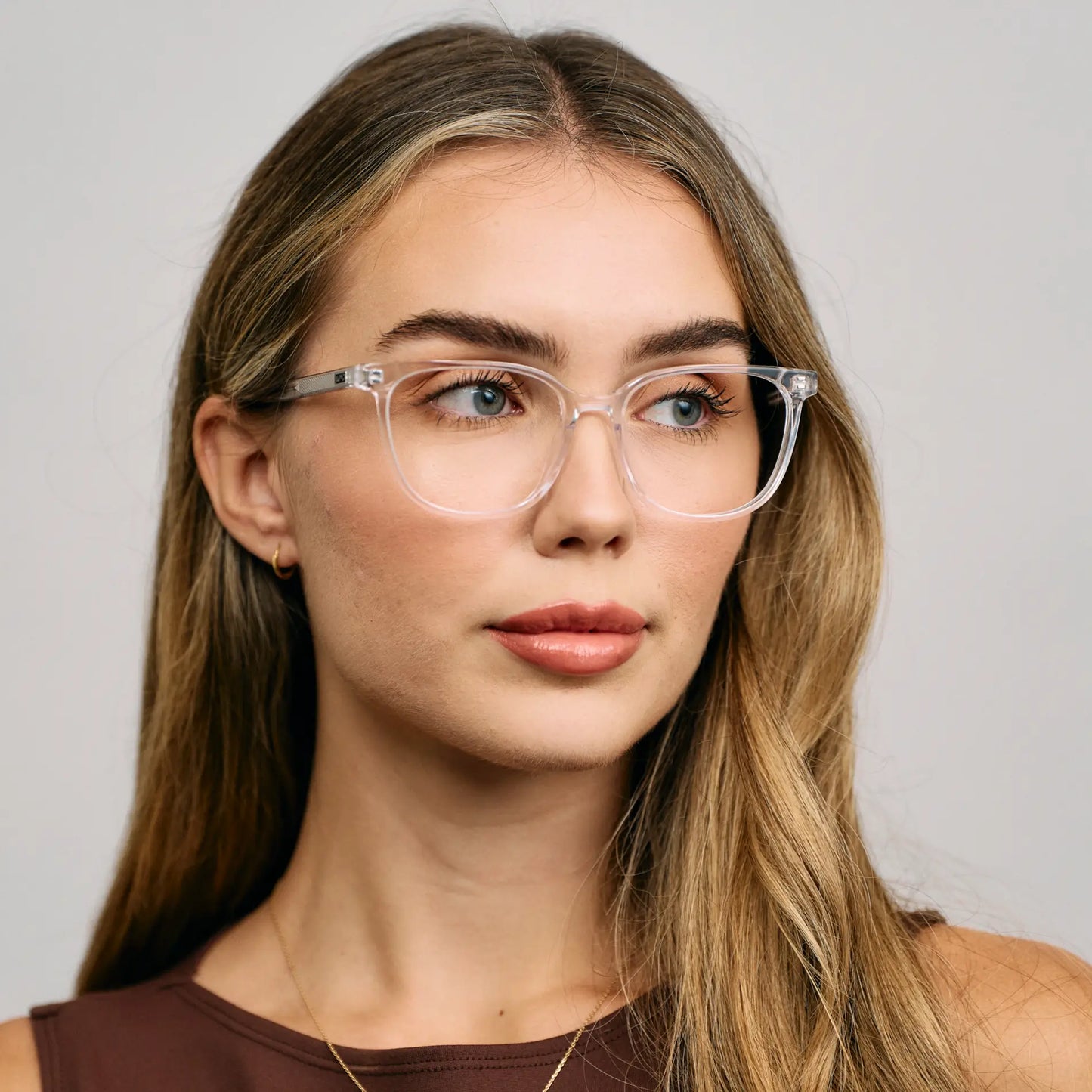 Clear || Female Model wearing Women's Rectangular Blue Light Blocking Glasses with a Clear Acetate Frame and Clear Lens