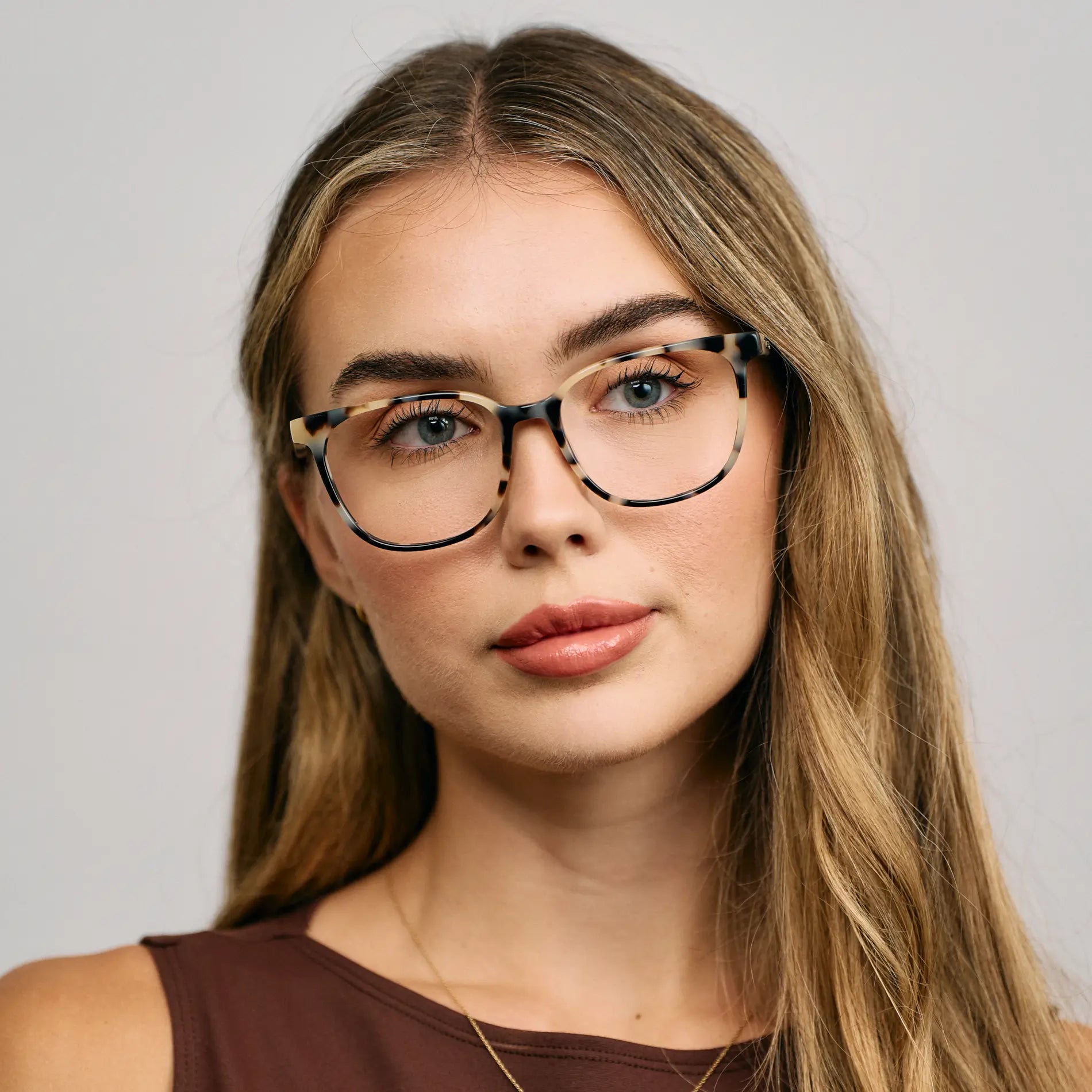 Beige Tortoise || Female Model wearing Women's Rectangular Blue Light Blocking Glasses with a Beige Tortoise Acetate Frame and Clear Lens