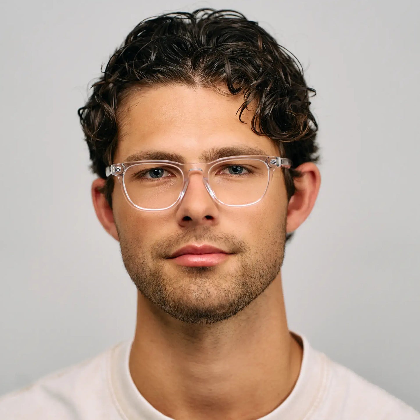 Clear || Model wearing Men's Rectangular Prescription Glasses with Clear Acetate Frame and Clear Lens