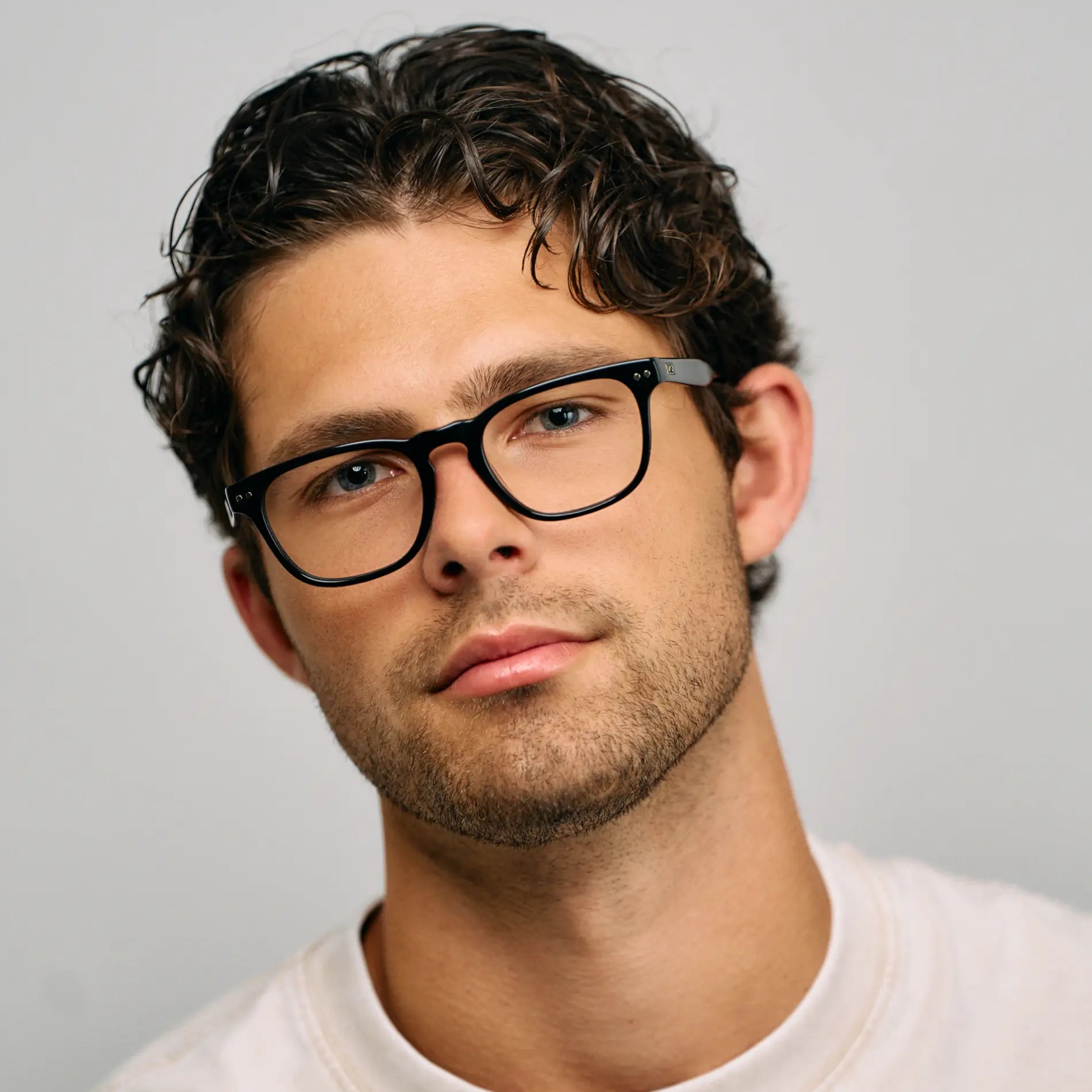 Black || Male Model wearing Men's Rectangular Blue Light Blocking Glasses with Black Acetate Frame and Clear Lens