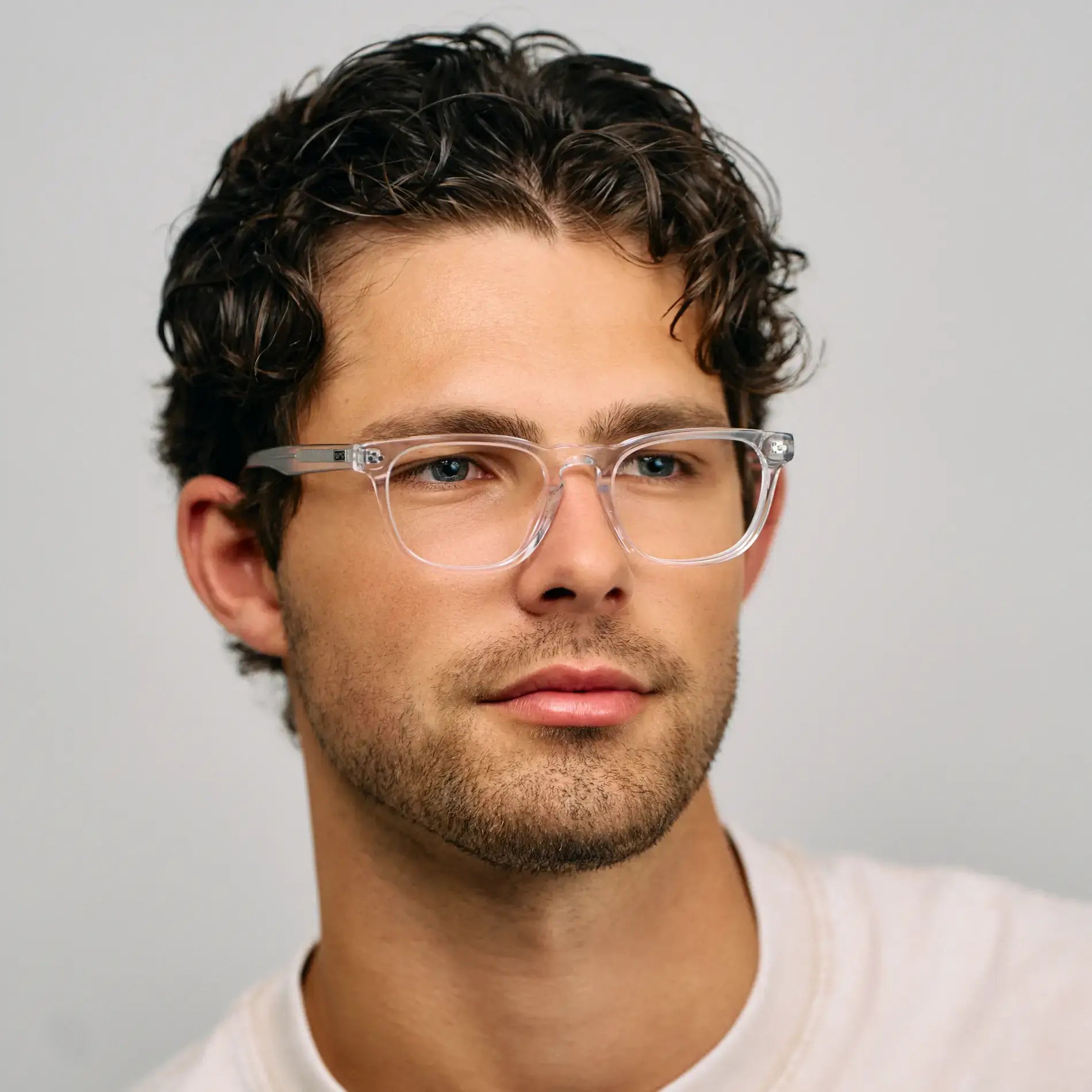 Clear || Model wearing Men's Rectangular Prescription Glasses with Clear Acetate Frame and Clear Lens