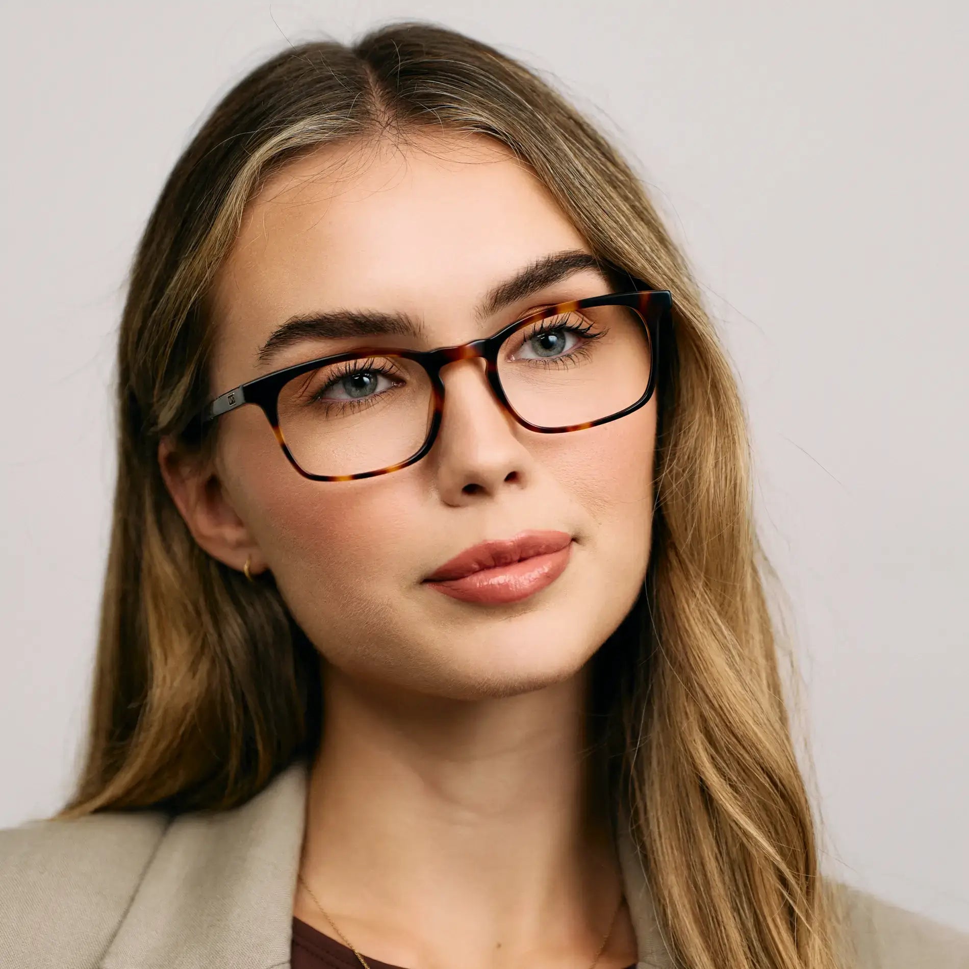 Brown Tortoise || Model wearing Women's Rectangular Prescription Glasses with a Brown Tortoise Acetate Frame and Clear Lens