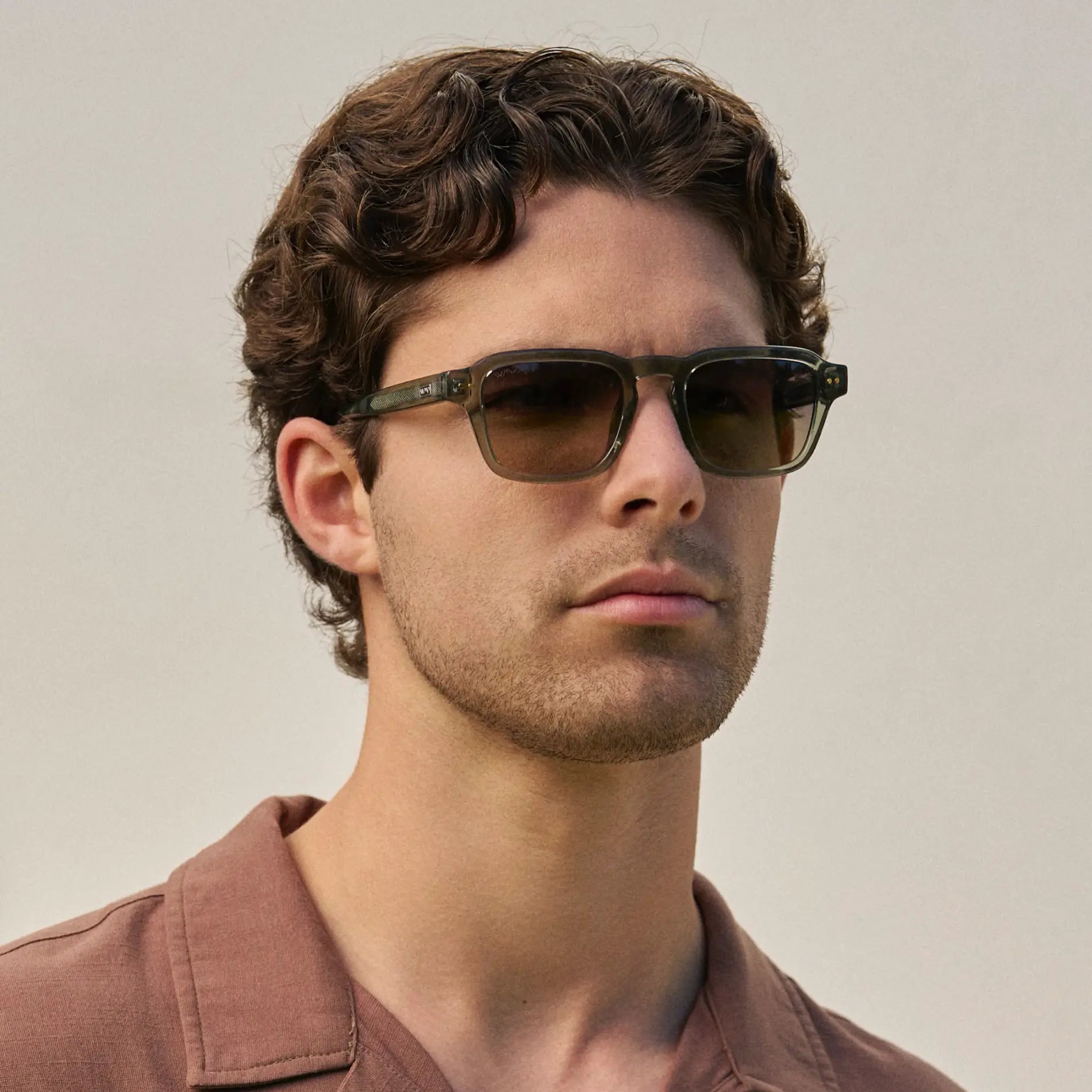 Sage Green / Amber || Model wearing Men's Rectangular Prescription Sunglasses with Sage Green Acetate Frame and Amber Prescription Lens