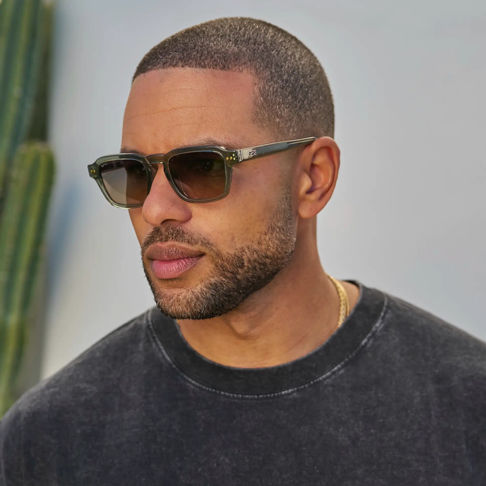 Sage Green / Grey Brown Gradient Lens || Model wearing Men's Rectangular Polarized Sunglasses with Sage Green Acetate Frame and Grey Brown Gradient Lens