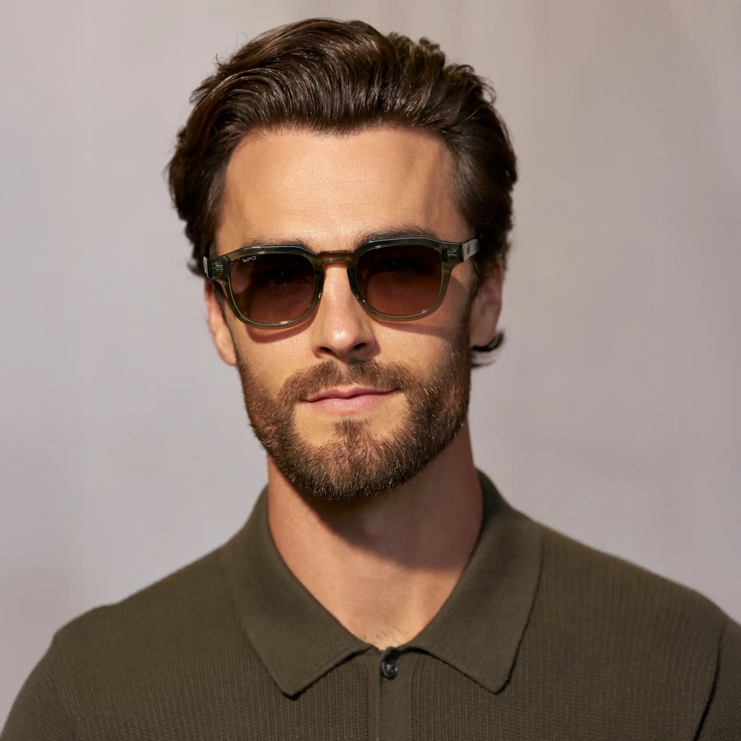 Crystal Agave Green / Grey Brown Gradient Lens || Model wearing Men's Geometric Square Polarized Sunglasses with Green Acetate Frame and Grey Brown Gradient Lens