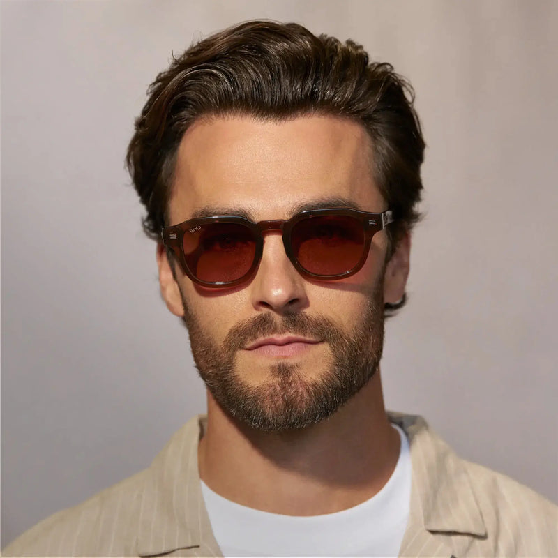 Front-facing close-up of a model wearing Nelson sunglasses in Terracotta Brown.