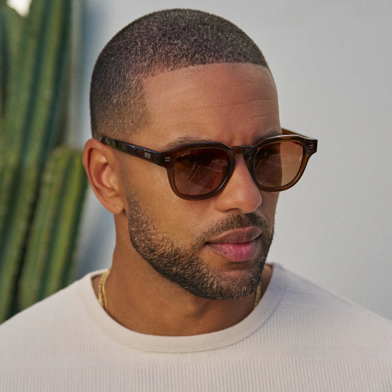 Man wearing WMP Eyewear Nelson sunglasses in terracotta brown with gradient brown lenses