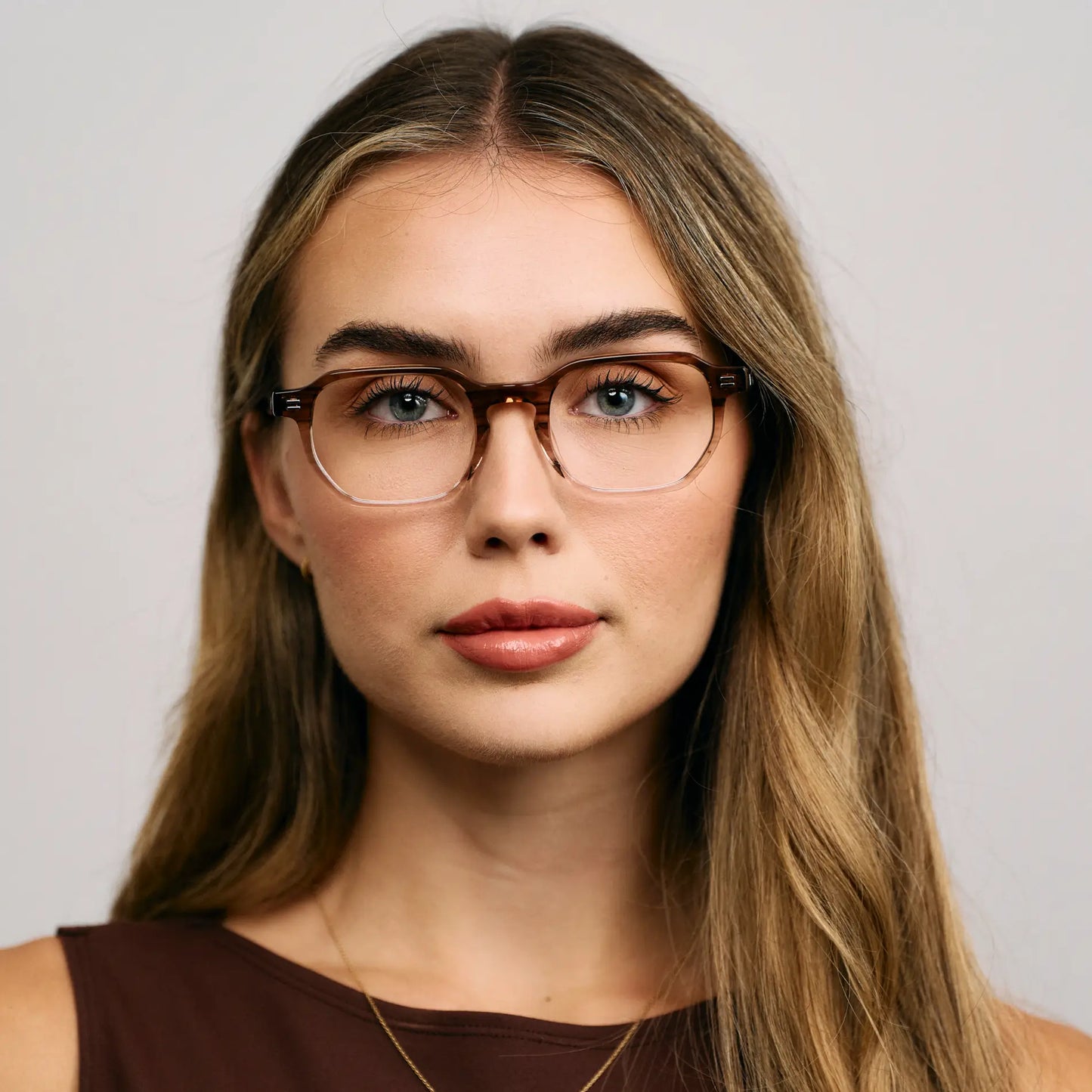 Pale Cedar Brown || Female model wearing Unisex Geometric Rectangular Blue Light Glasses with Dual-Tone Pale Cedar Brown Acetate Frame