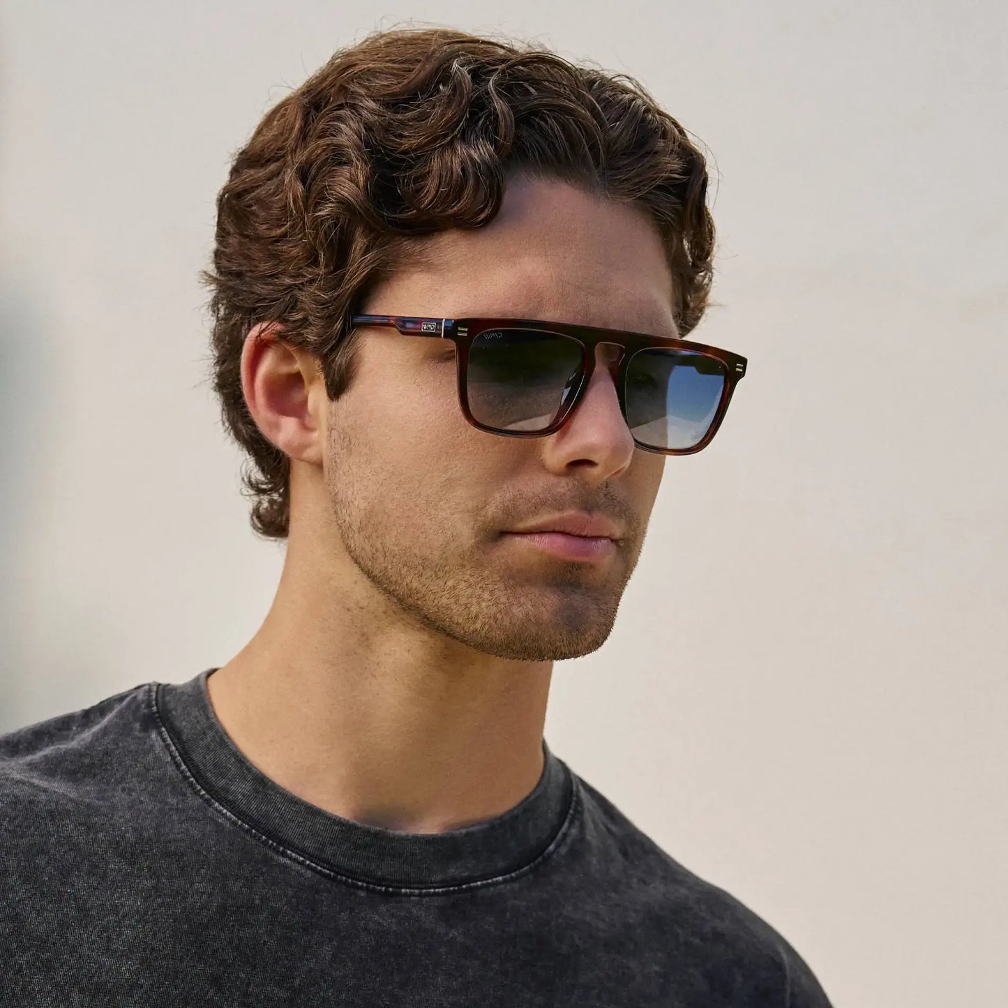 Brown Tortoise / Blue Gradient Lens || Man wearing Brown Tortoise Square Sunglasses with Blue Gradient Polarized Lenses outdoors