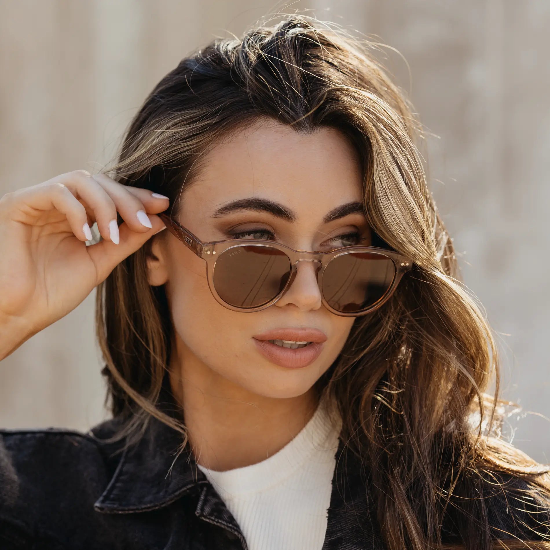 Brown Case || Woman wearing translucent brown frame sunglasses with brown lenses outdoors in natural light