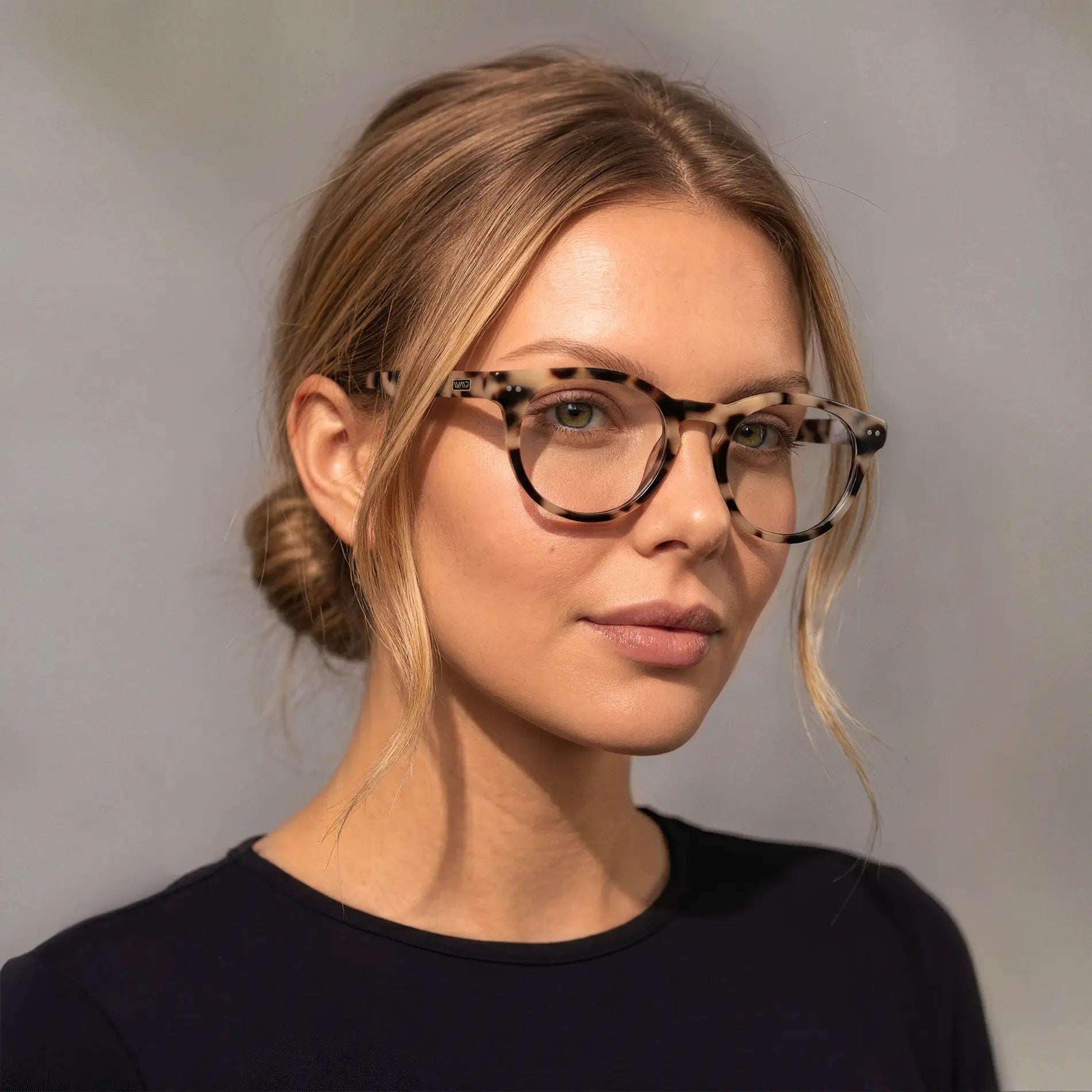 Beige Tortoise || Round acetate prescription eyeglasses with subtle beige tortoise pattern frame worn by woman indoors