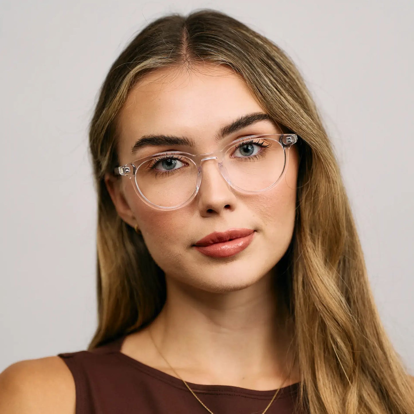 Clear || Model wearing Women's Round Prescription Glasses with a Clear Acetate Frame and Clear Lens