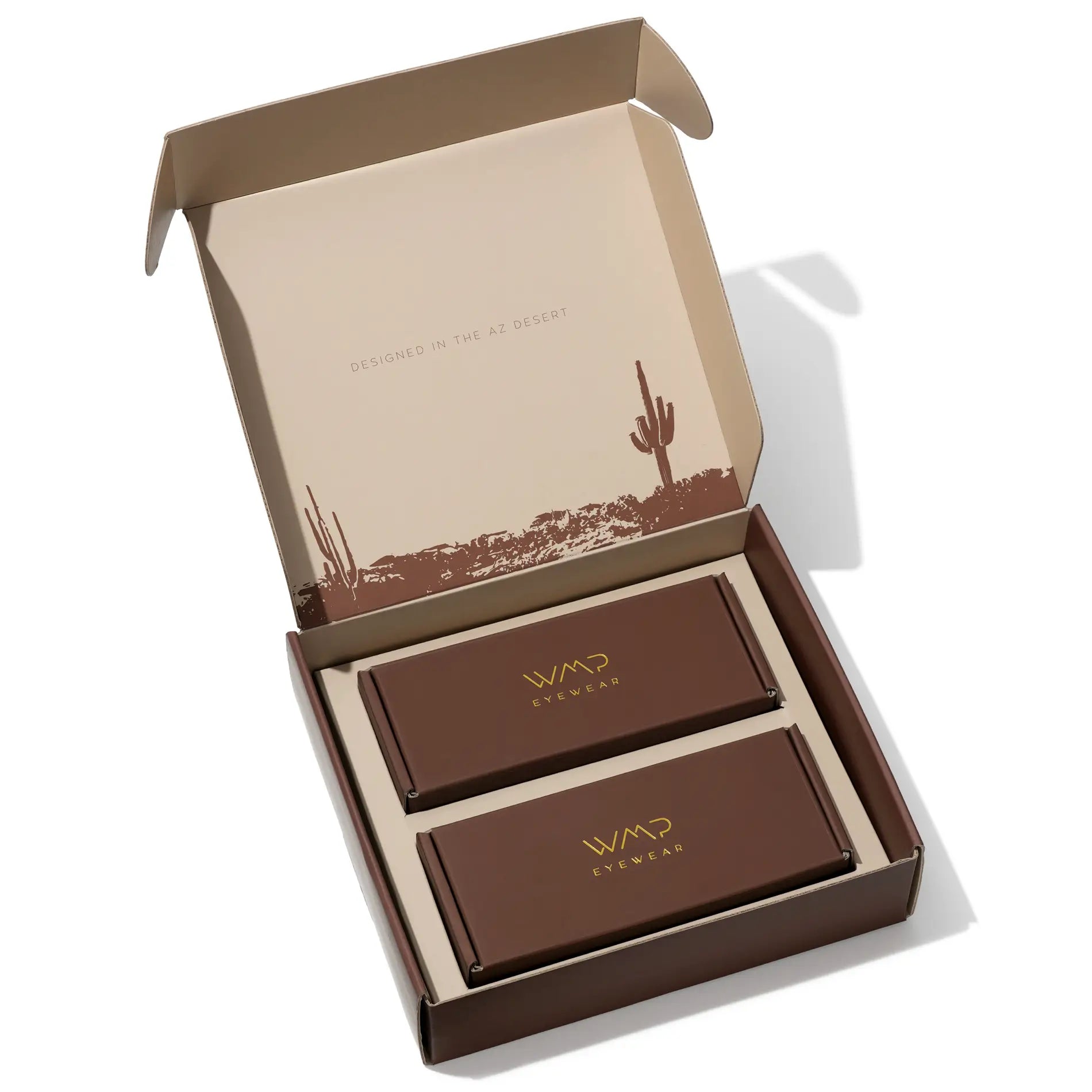 Fits Two Pairs || Two brown eyewear boxes in a decorative gifting box with a cactus design on the lid.