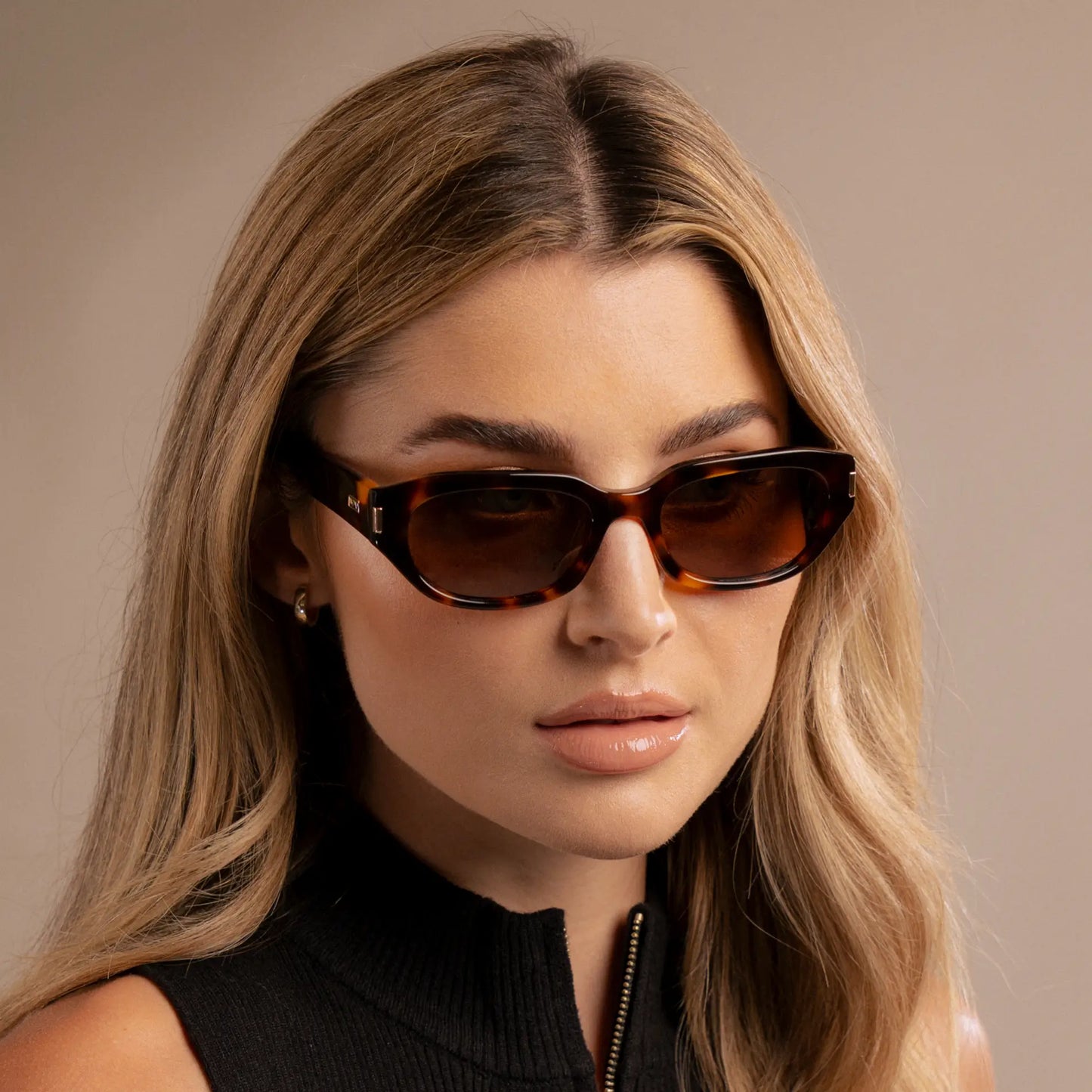 Brown Tortoise / Brown Lens || Model wearing Women's Oval Polarized Sunglasses with Brown Tortoise Frame and Brown Lenses