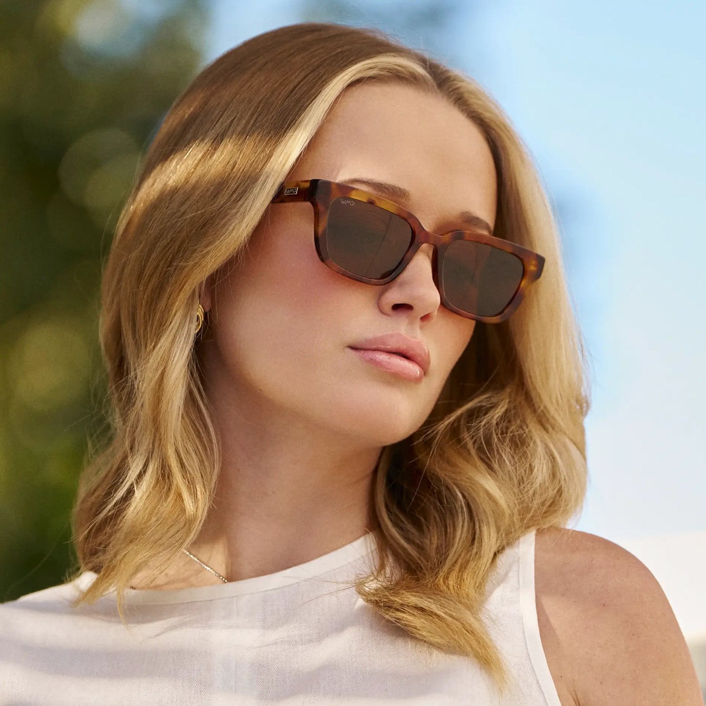 Honeycomb Tortoise / Brown Lens || Model wearing Women's Rectangular Sunglasses with Honeycomb Tortoise Acetate Frame and Brown Polarized Lens