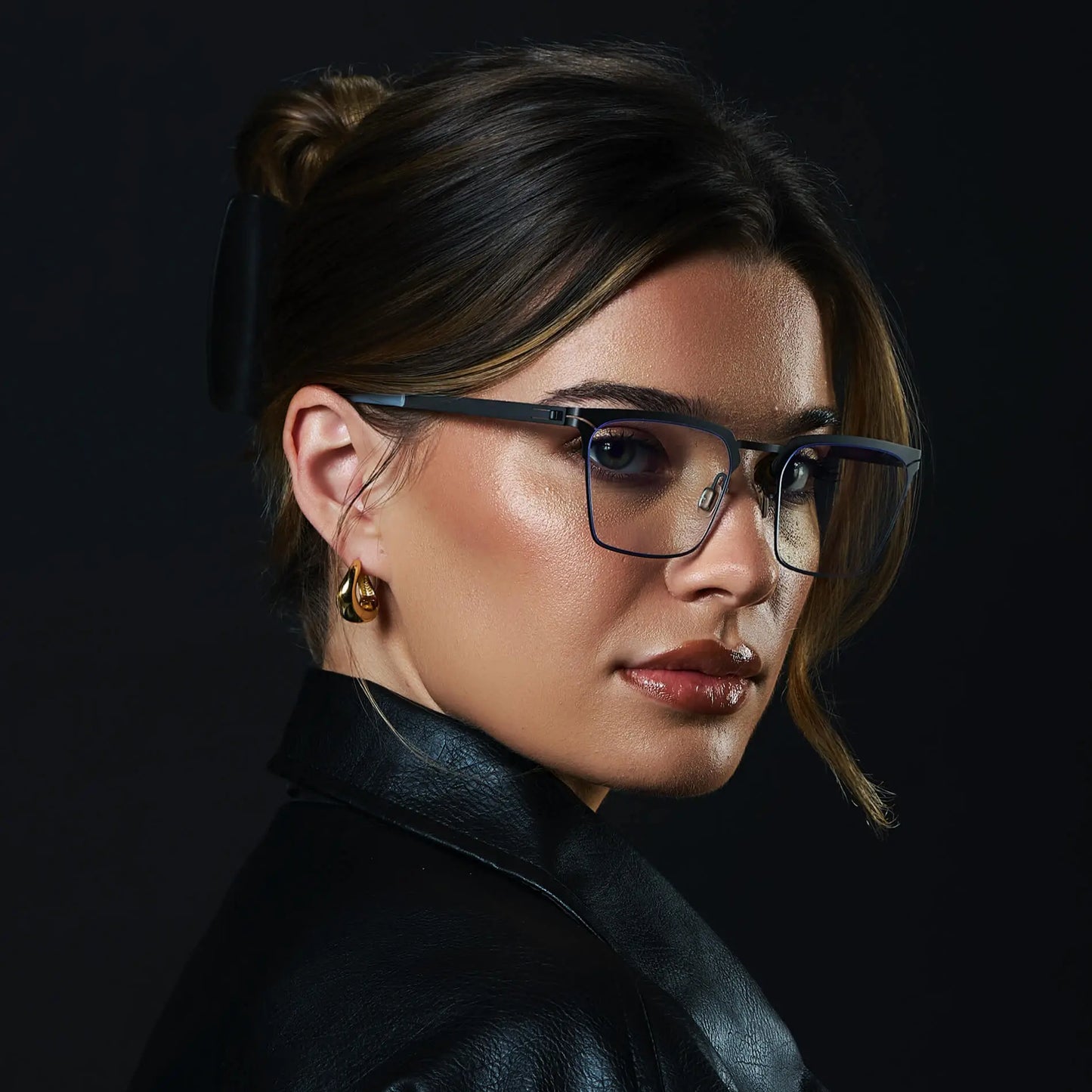 Matte Black || Raven blue light glasses with slim matte black metal frame and square lenses worn by a woman 