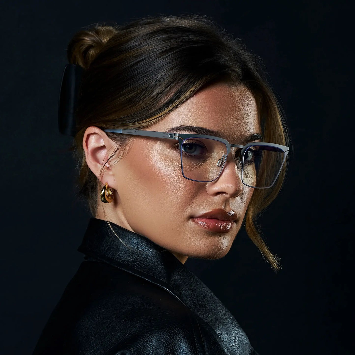 Matte Grey || Raven blue light glasses with a thin rim frame matte grey frame and rectangular clear lenses worn by woman 