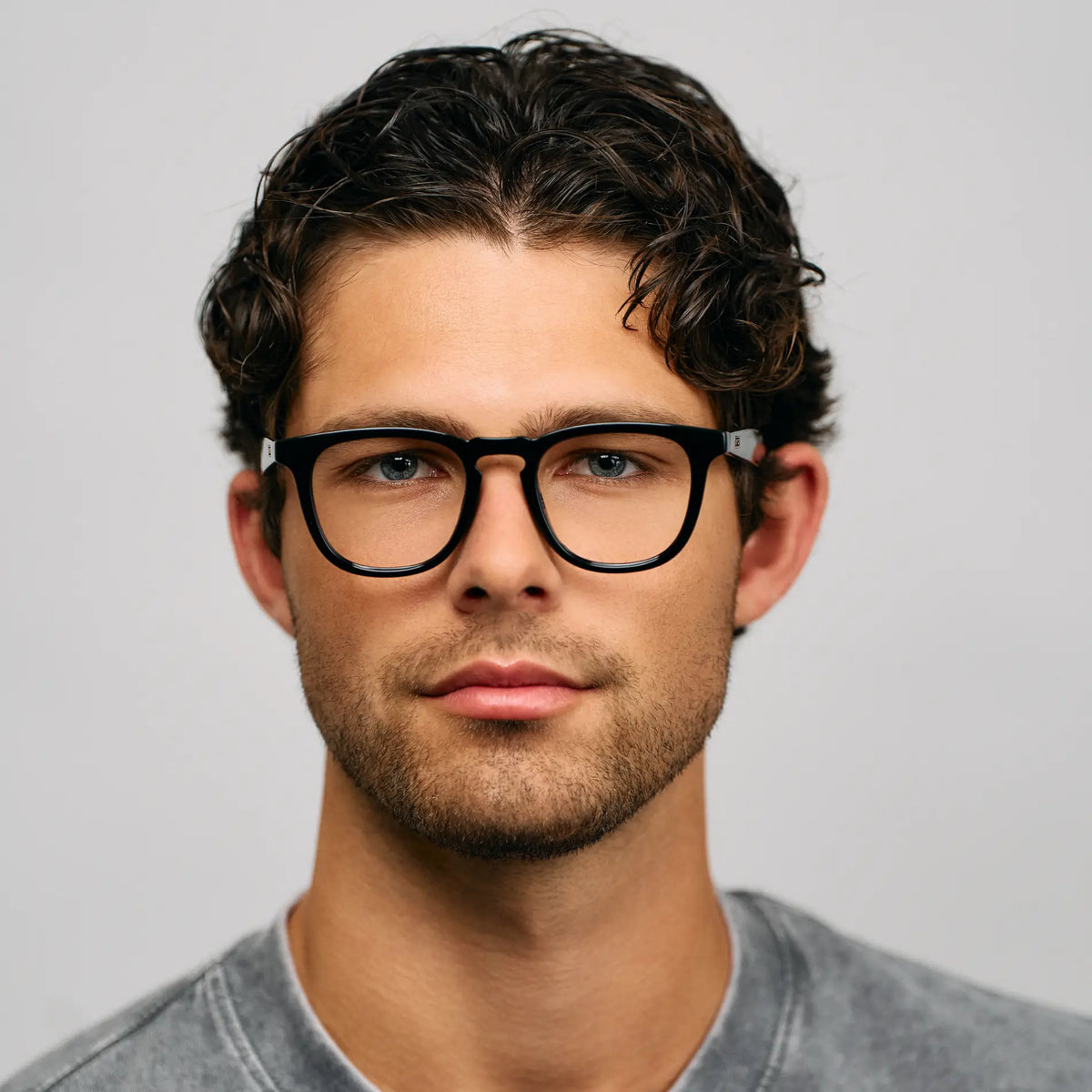 Model wearing Men's Medium Fit Round Prescription Glasses with Black Frame and Clear Lens