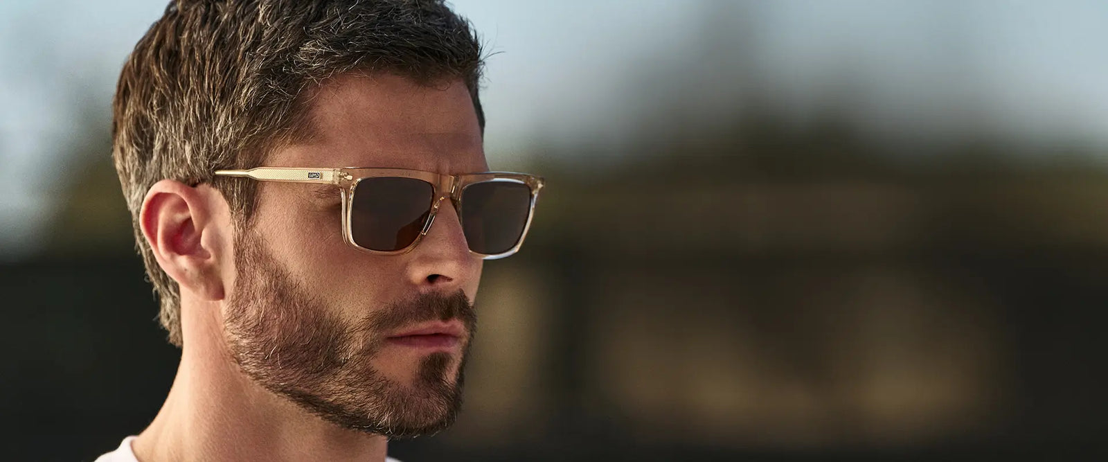 Man wearing WMP Performance sunglasses in translucent sand brown with brown lenses