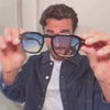 Model wearing WMP Eyewear Tint Collection rectangular sunglasses in black with gradient blue lenses, close-up video