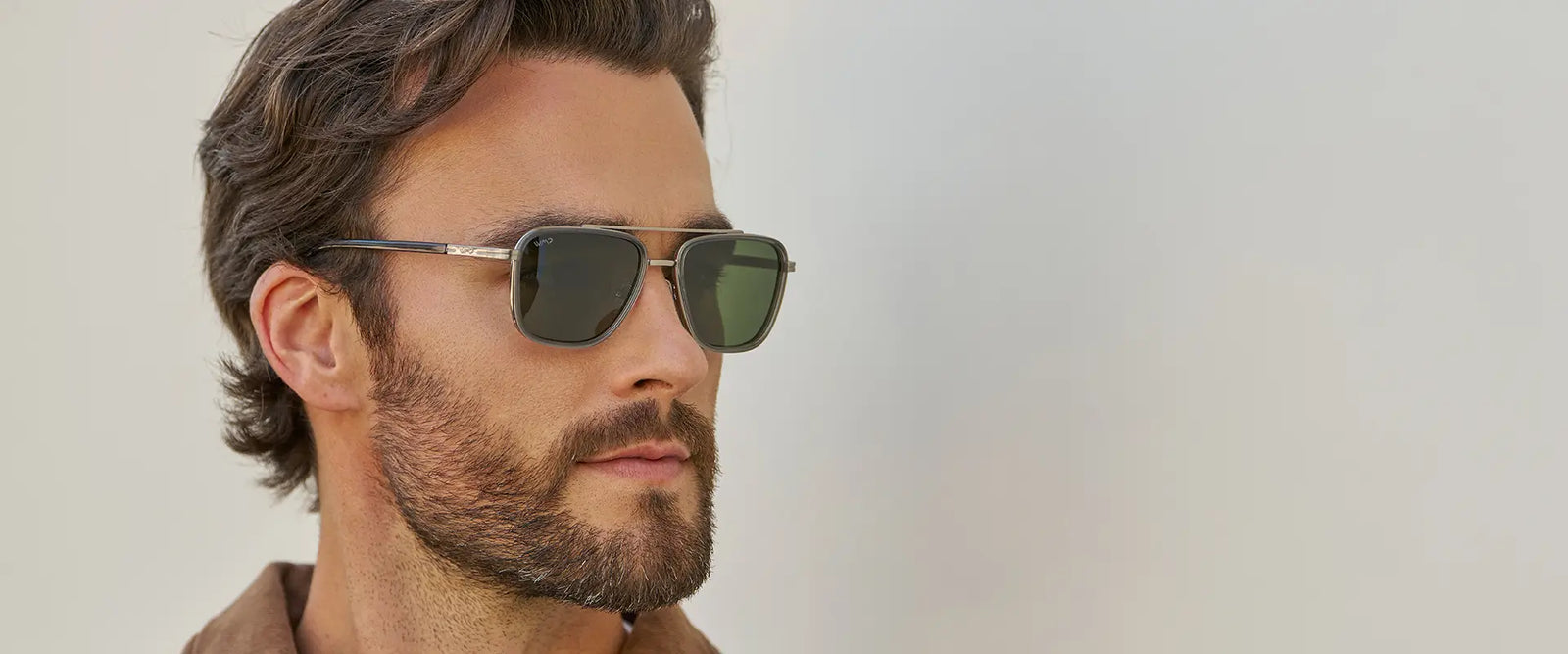 Close-up of a model wearing Weston aviator sunglasses in Smoke Grey with Smoke Green lenses against a neutral background.